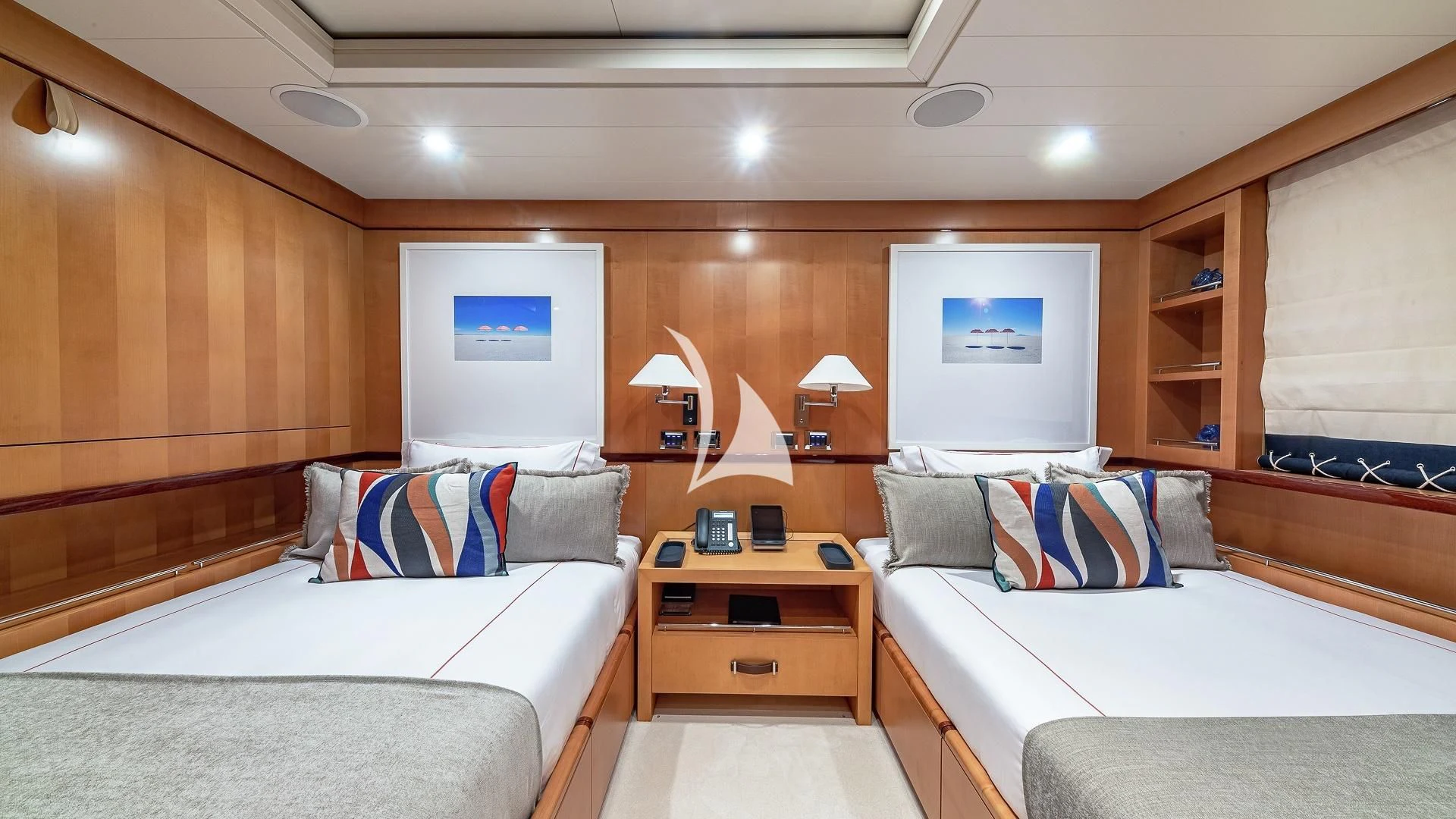 a room with two beds aboard LIND Yacht for Charter