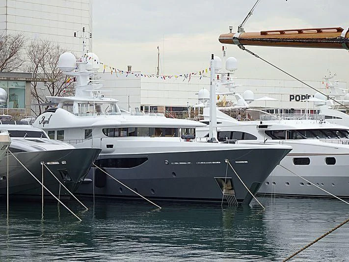 a few white yachts in a harbor aboard LIND Yacht for Charter