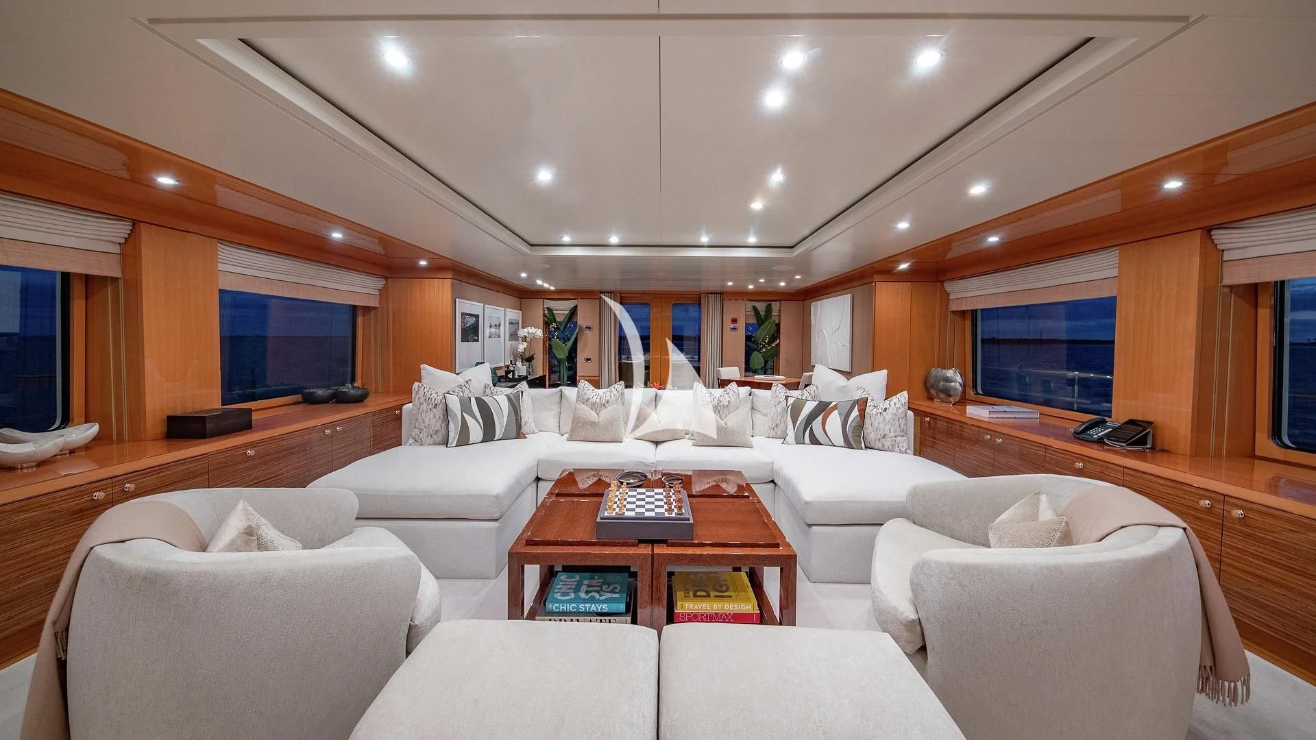a living room with a couch and a coffee table aboard LIND Yacht for Charter