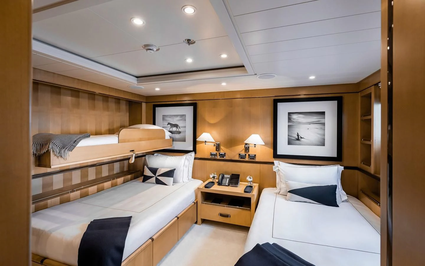 a room with two beds aboard LIND Yacht for Charter