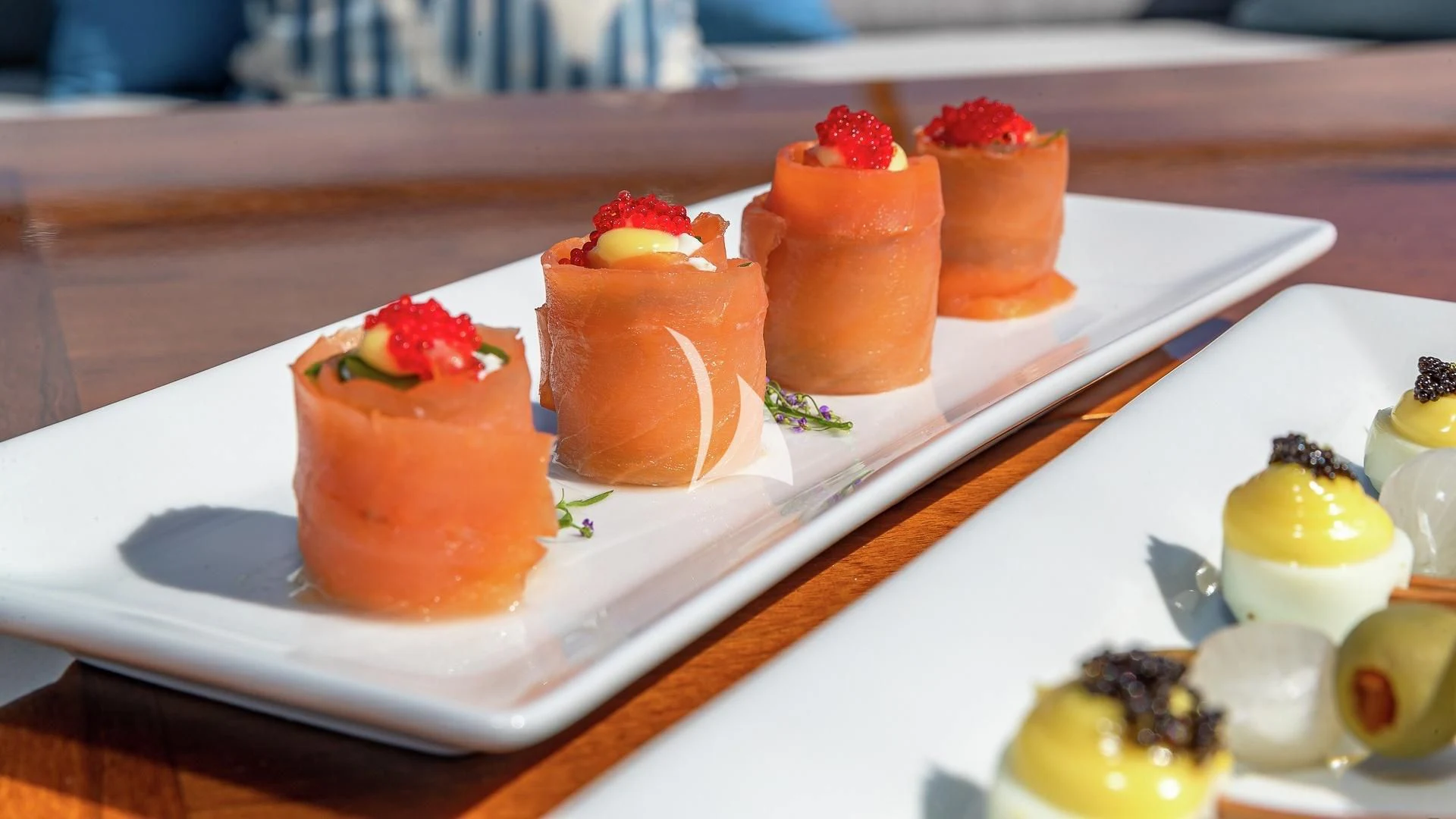 a plate of desserts aboard LIND Yacht for Charter