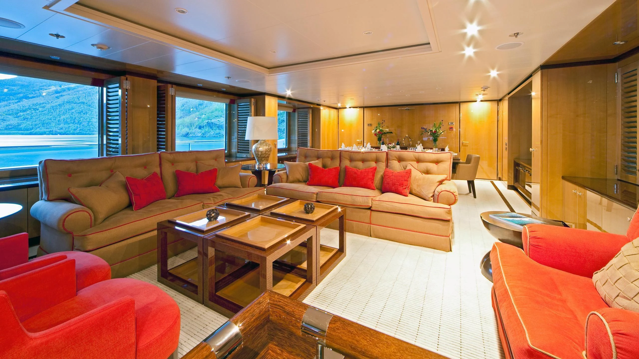 a living room with a large window aboard LIND Yacht for Charter