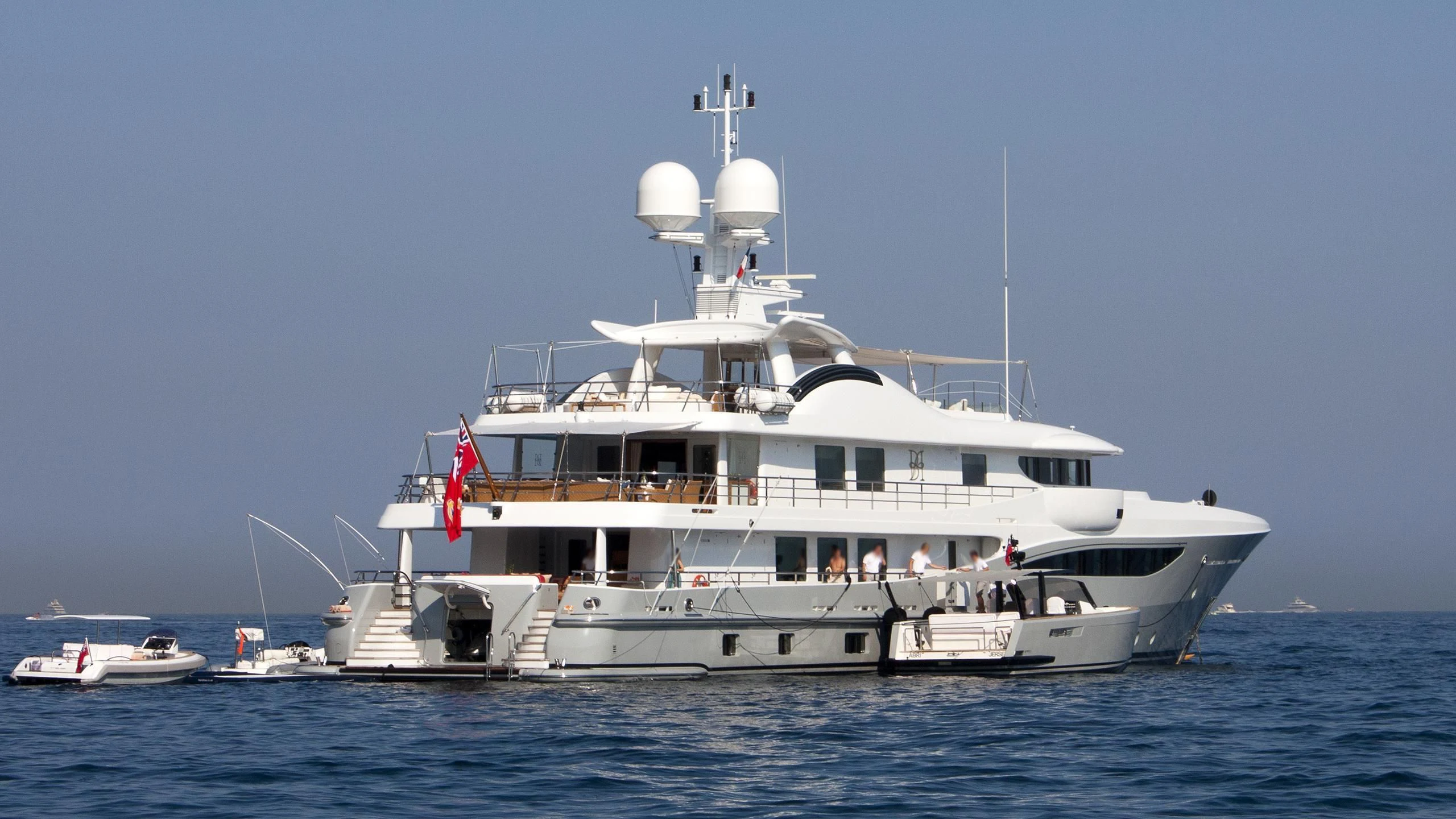 a large white boat in the water aboard LIND Yacht for Charter