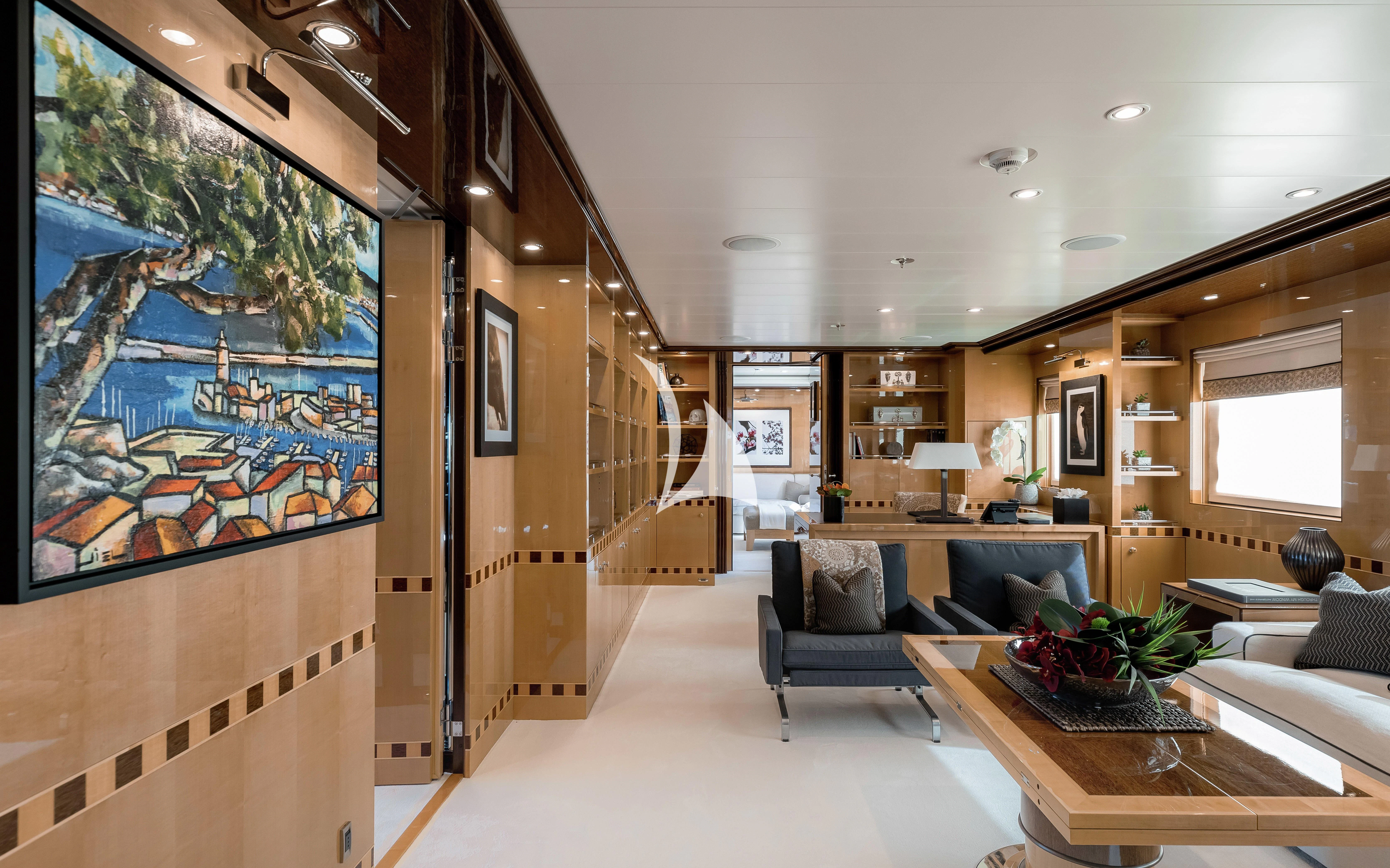 a living room with a large screen aboard LIND Yacht for Charter
