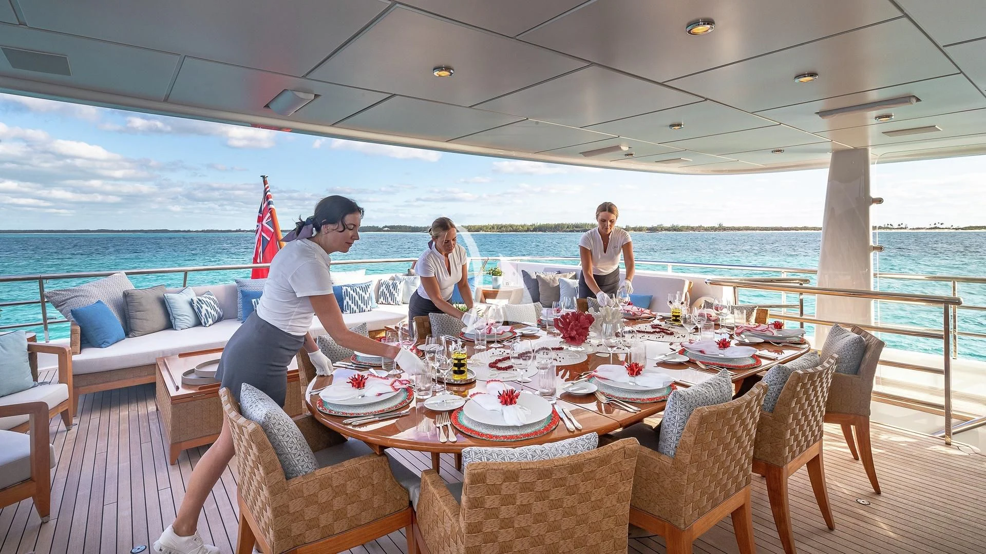 a couple of people sitting at a table with food on it aboard LIND Yacht for Charter