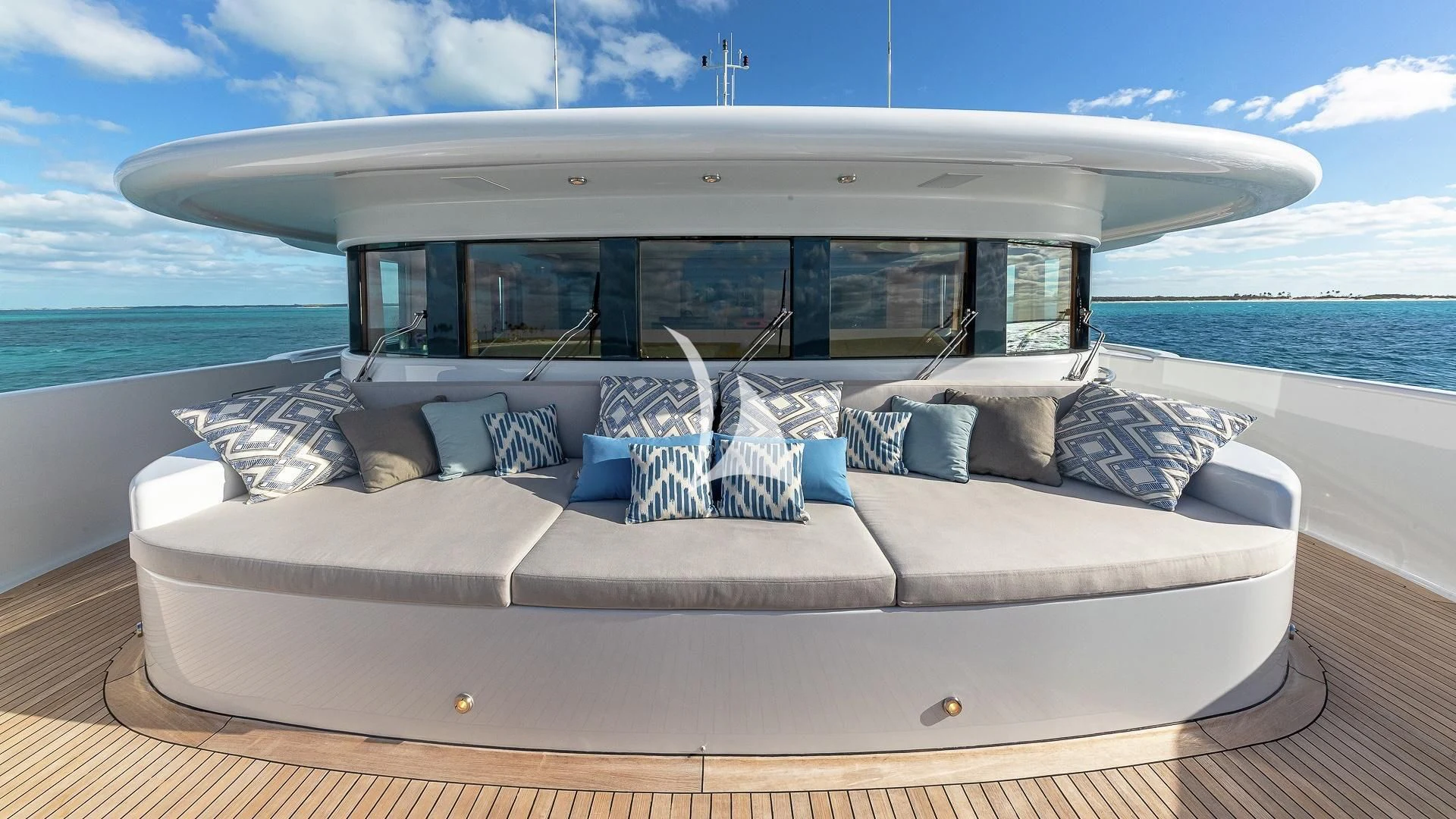 a white boat on a body of water aboard LIND Yacht for Charter