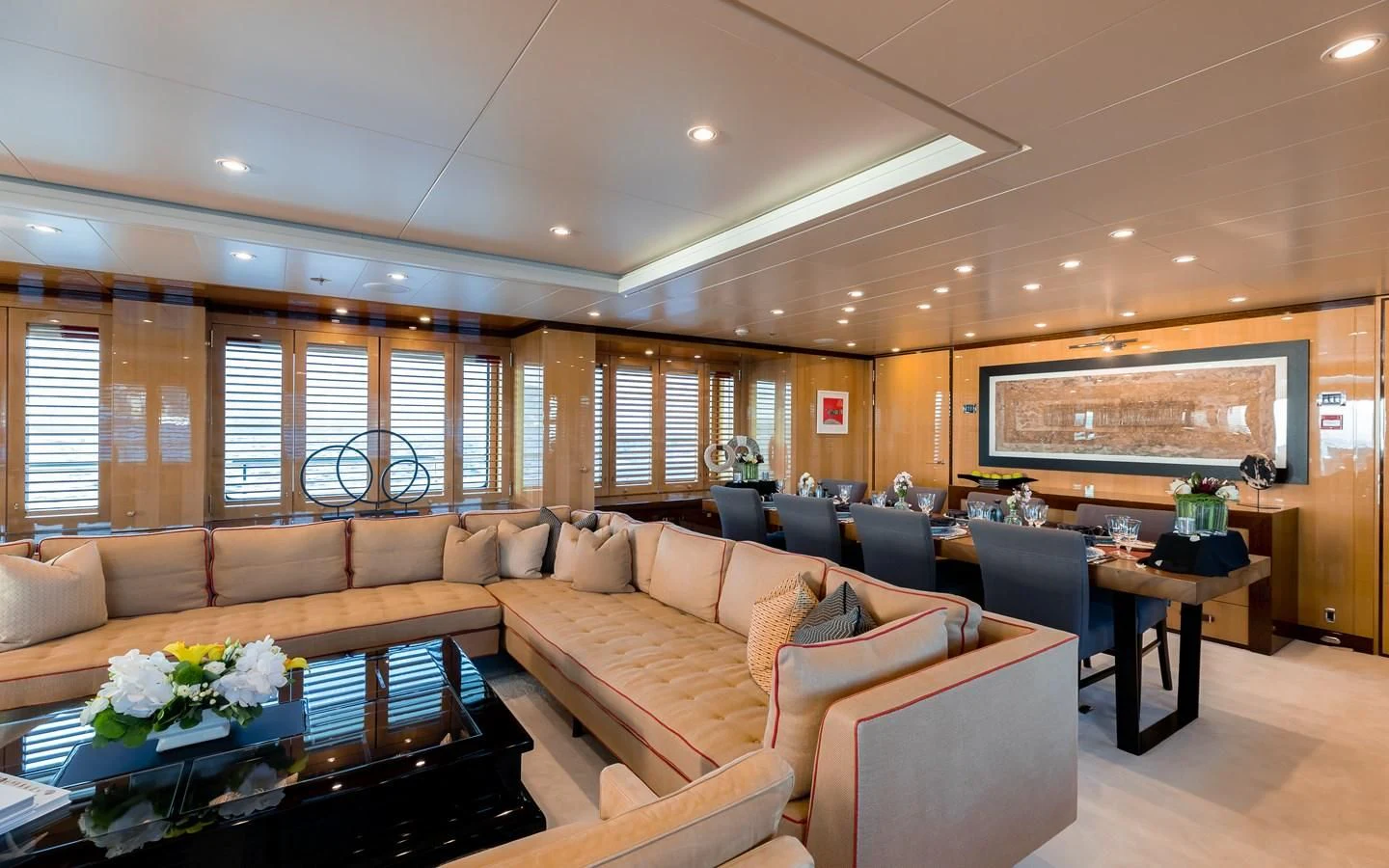 a living room with a large screen aboard LIND Yacht for Charter