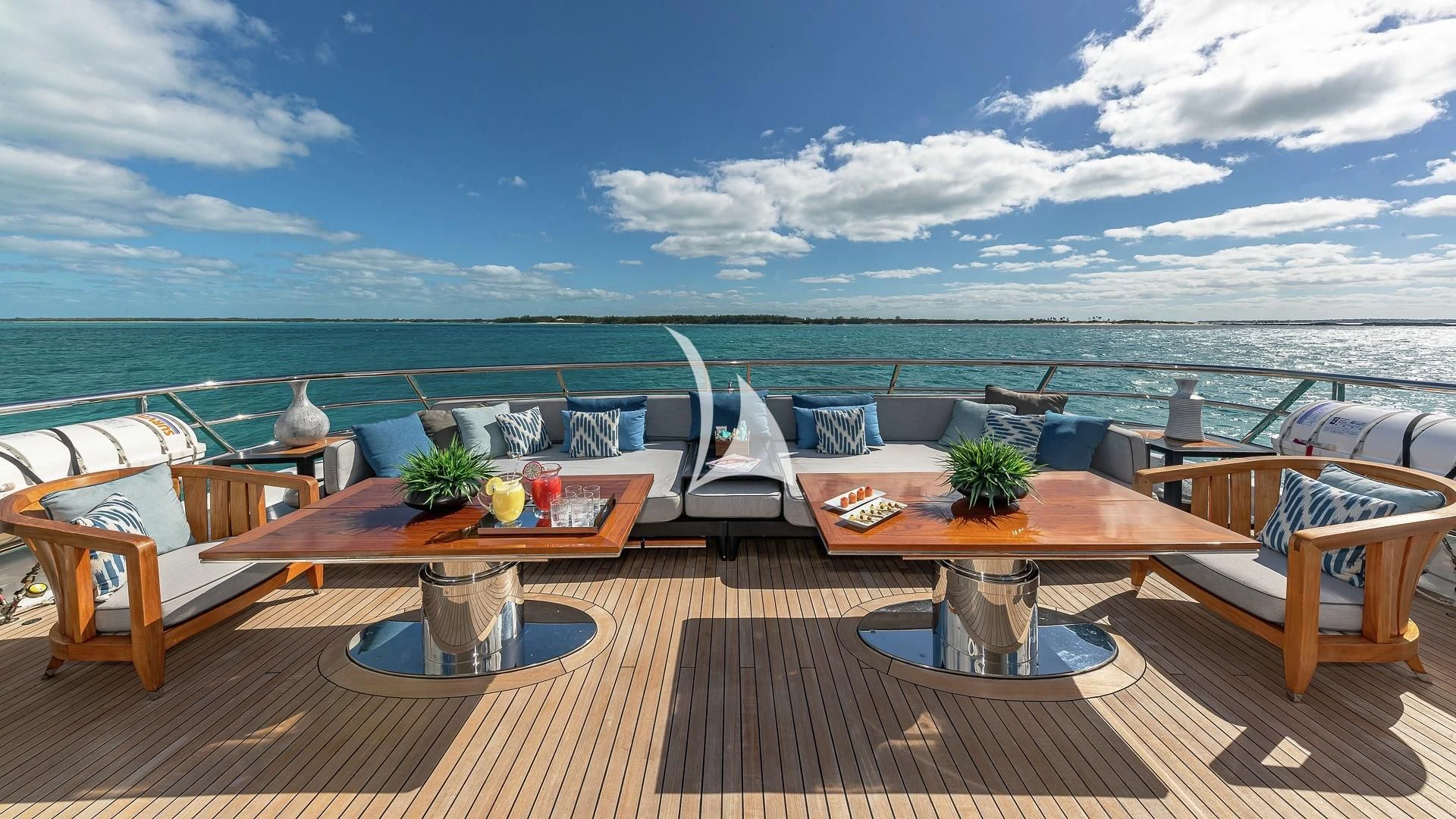 a patio with a table and chairs aboard LIND Yacht for Charter
