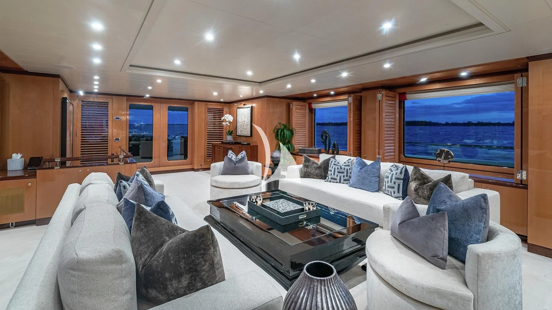 a living room with a large window aboard LIND Yacht for Charter