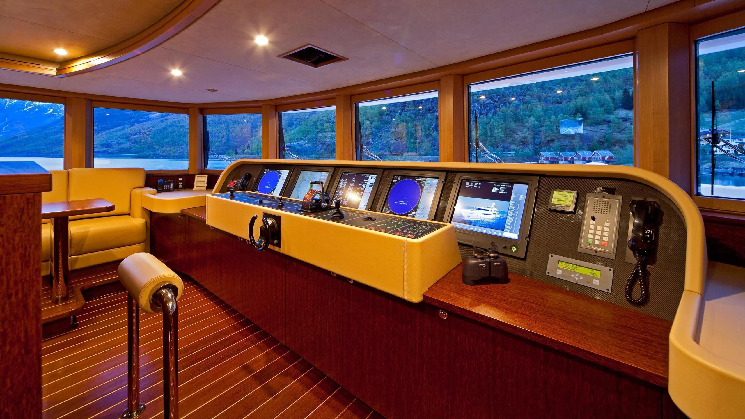 a room with a desk and computer aboard LIND Yacht for Charter