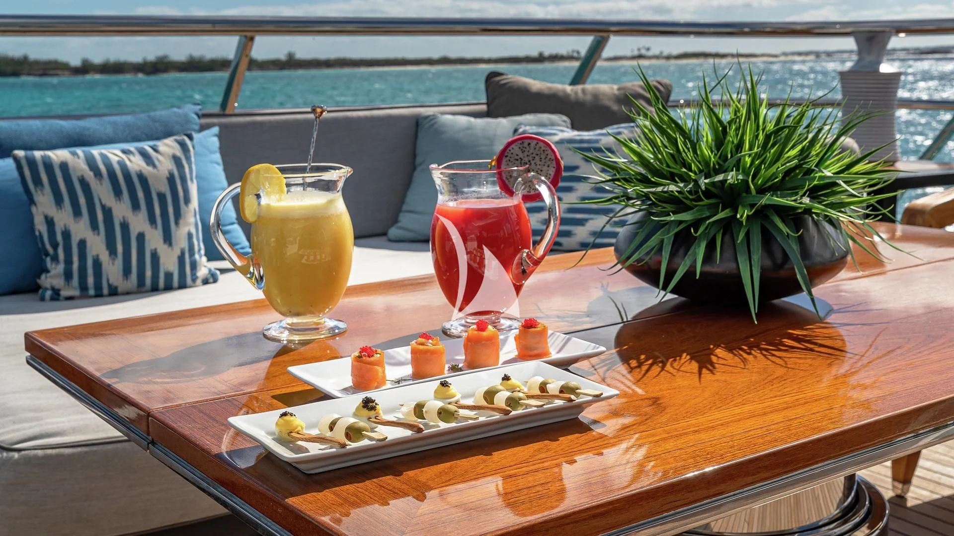a table with food and drinks on it aboard LIND Yacht for Charter