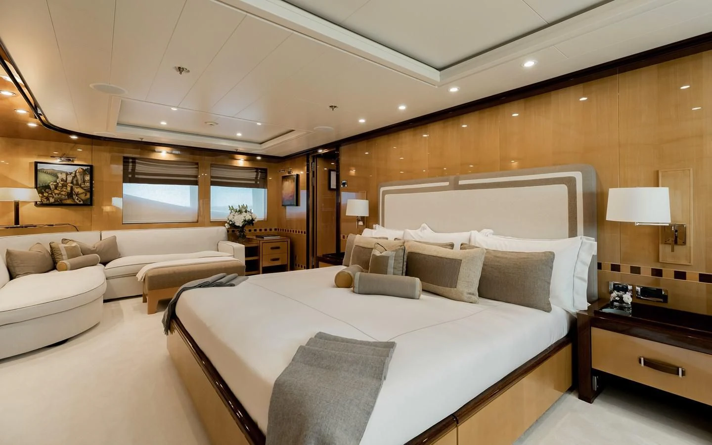 a large bedroom with a large bed aboard LIND Yacht for Charter