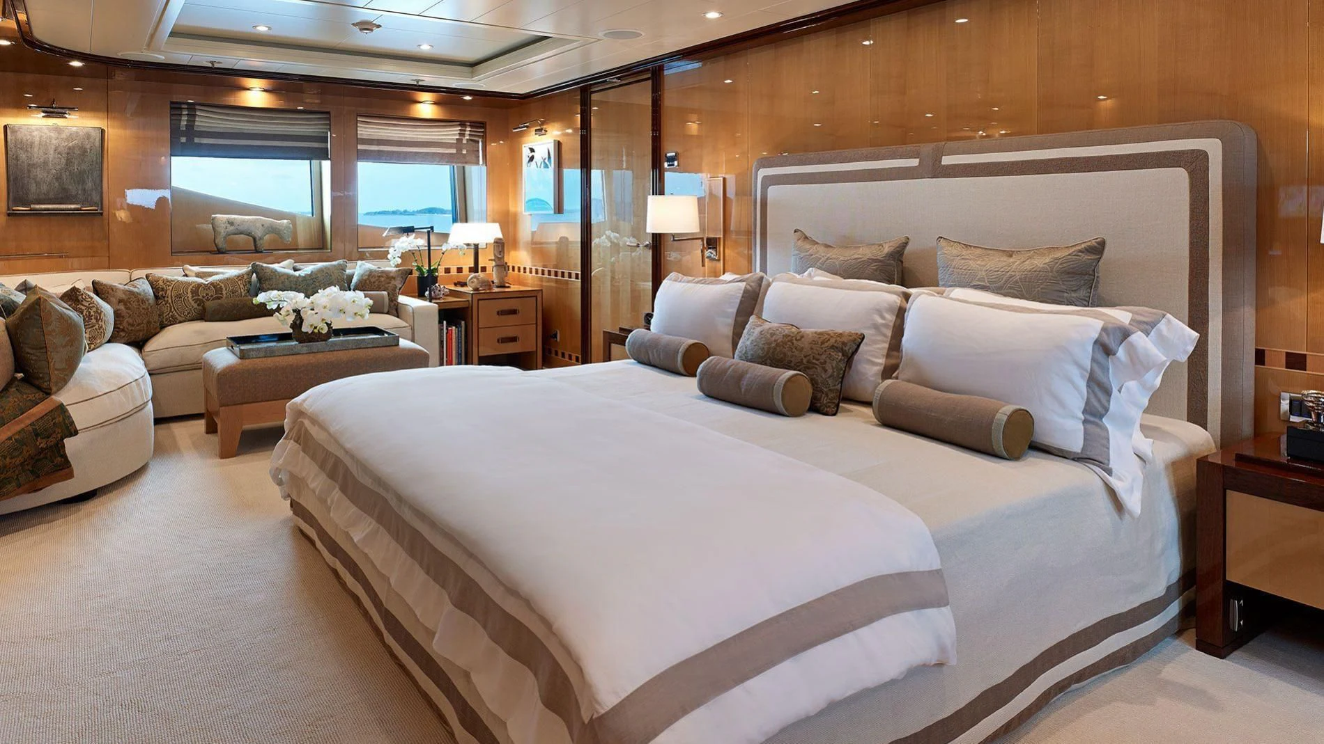 a large bed in a hotel room aboard LIND Yacht for Charter