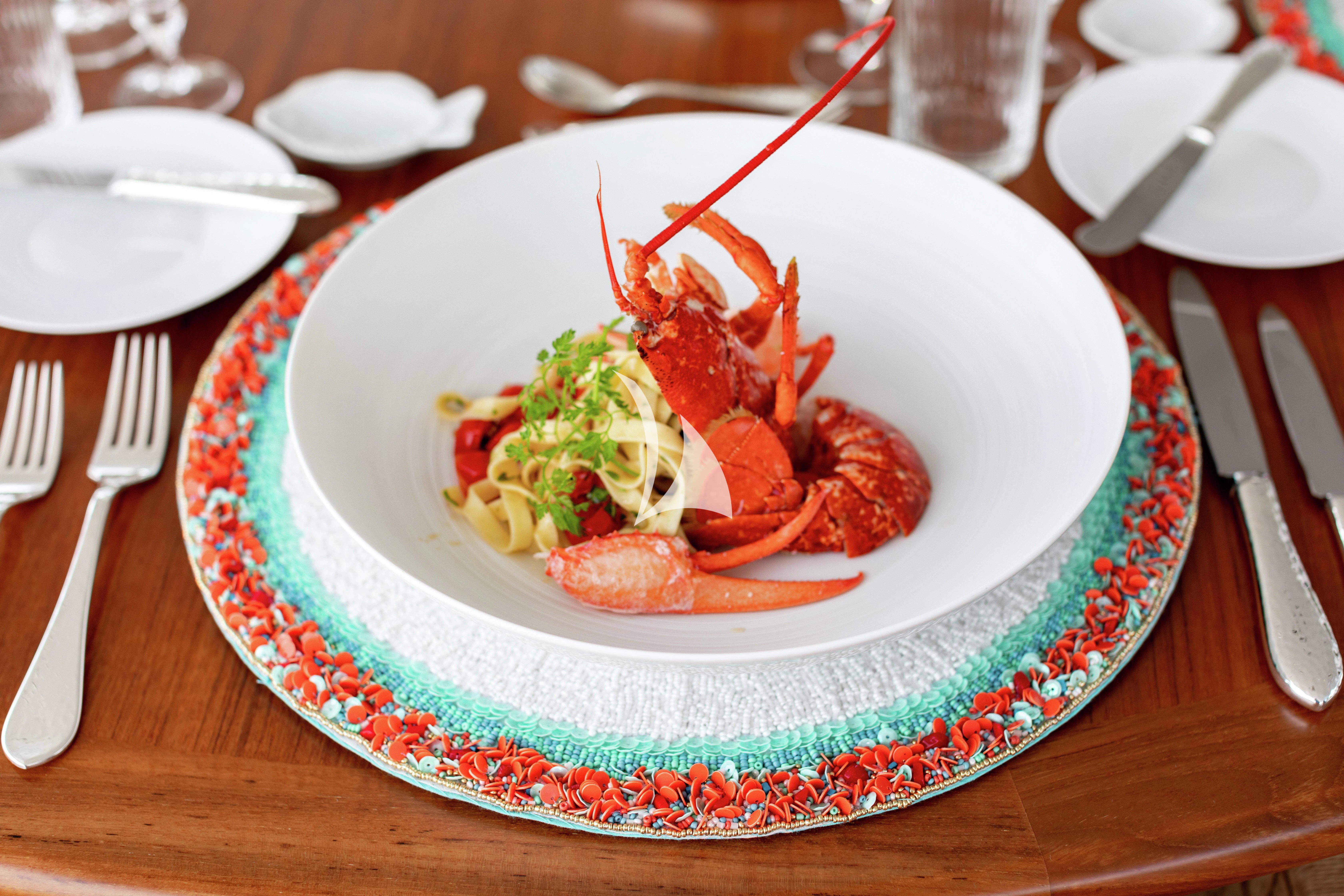 a plate of food aboard LIND Yacht for Charter