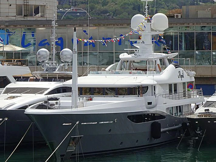 a boat docked in a harbor aboard LIND Yacht for Charter