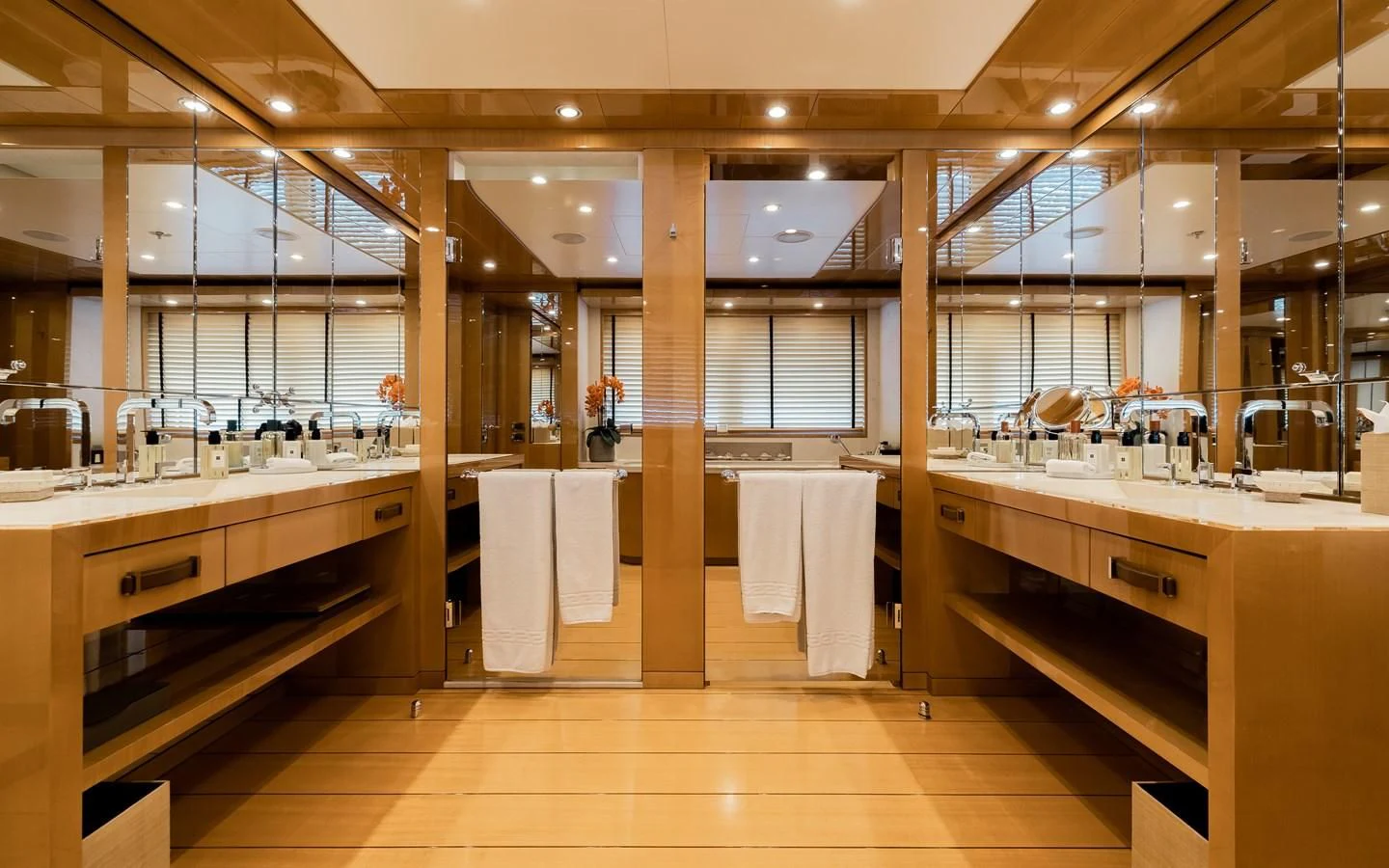 a bathroom with a large mirror aboard LIND Yacht for Charter
