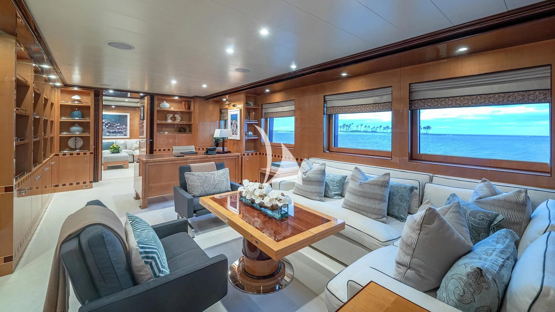 a living room with a couch and a coffee table aboard LIND Yacht for Charter