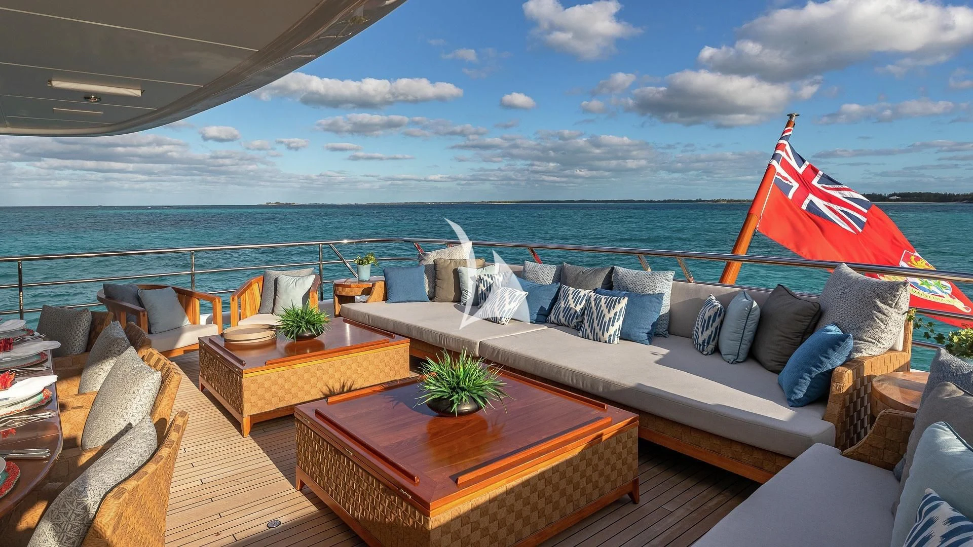 a large patio with a large flag aboard LIND Yacht for Charter