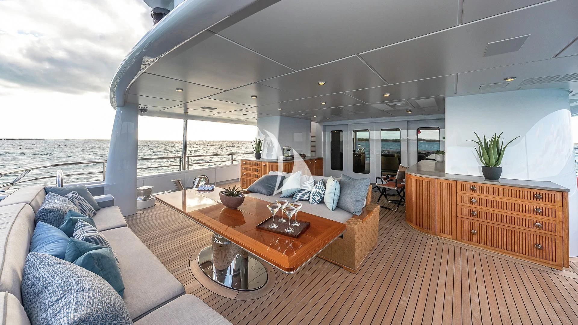 a living room with a large body of water aboard LIND Yacht for Charter