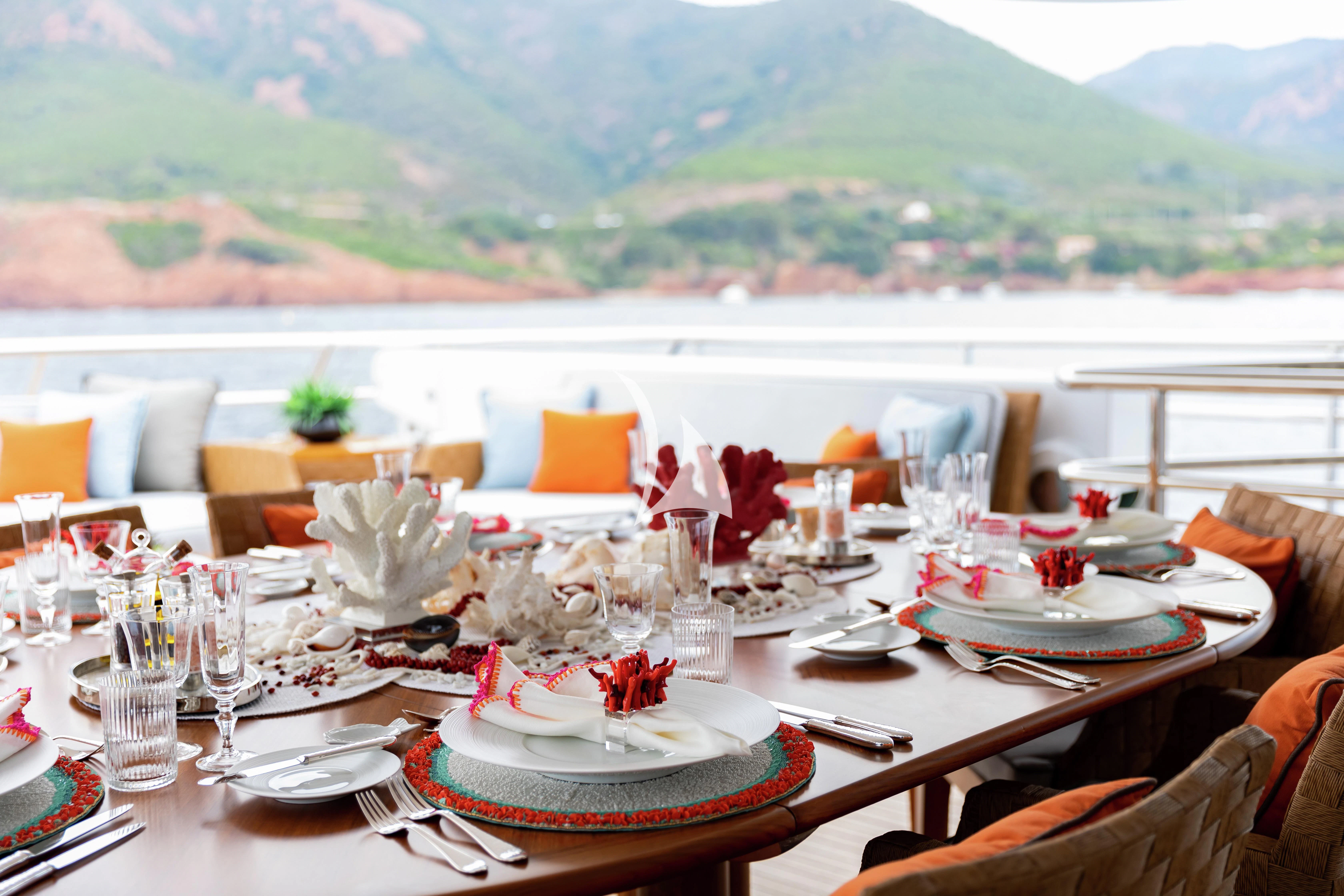 a table set for a dinner aboard LIND Yacht for Charter