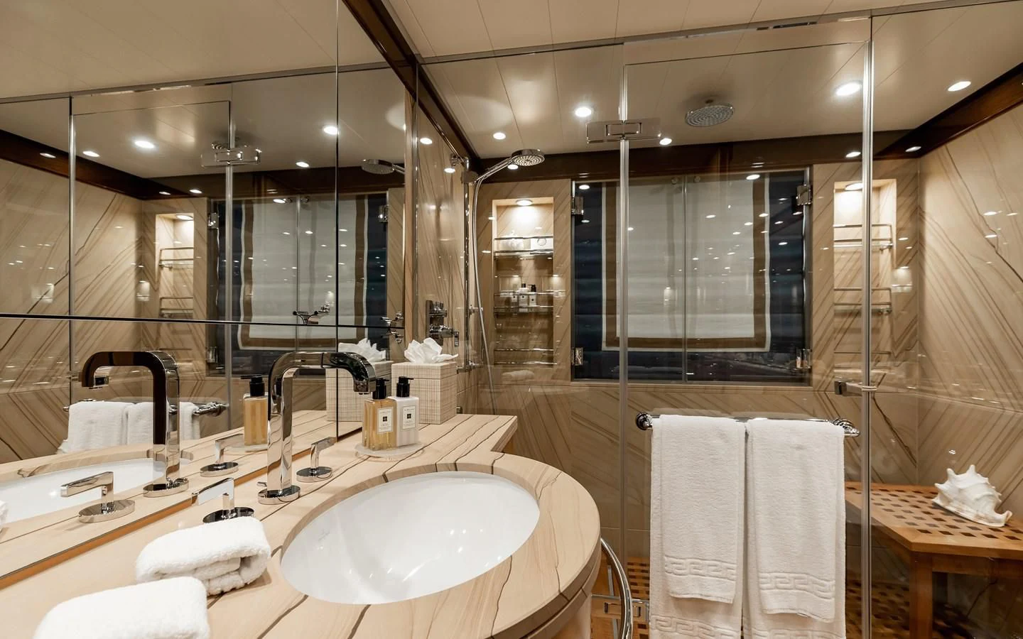 a bathroom with a large mirror aboard LIND Yacht for Charter
