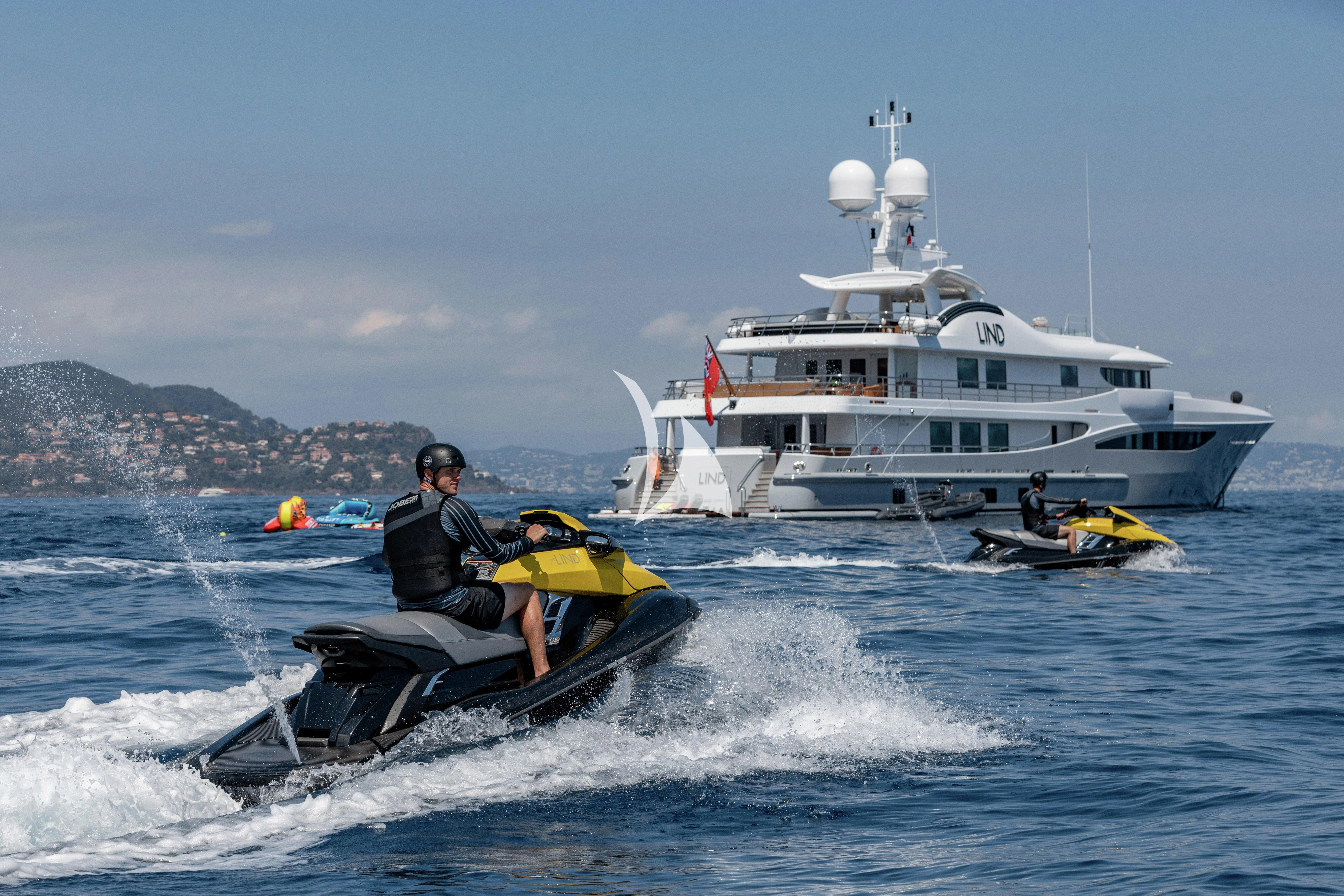 a boat with a person on it aboard LIND Yacht for Charter