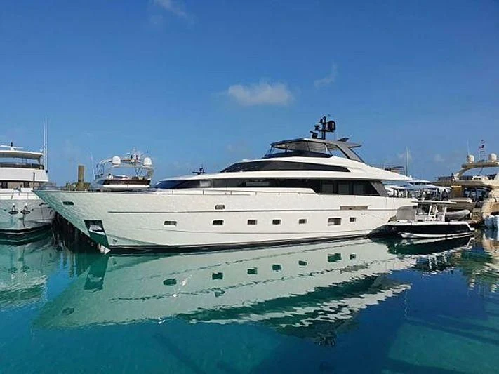 a large white boat in a harbor aboard ASTONISH Yacht for Sale
