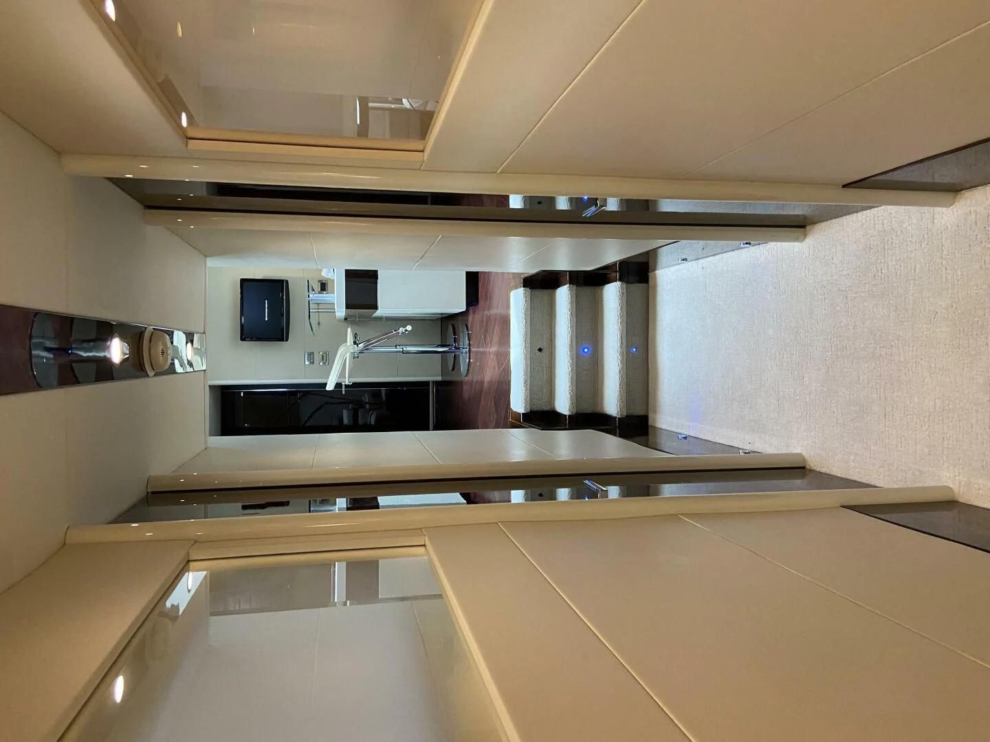 a kitchen with white cabinets aboard BG Yacht for Sale