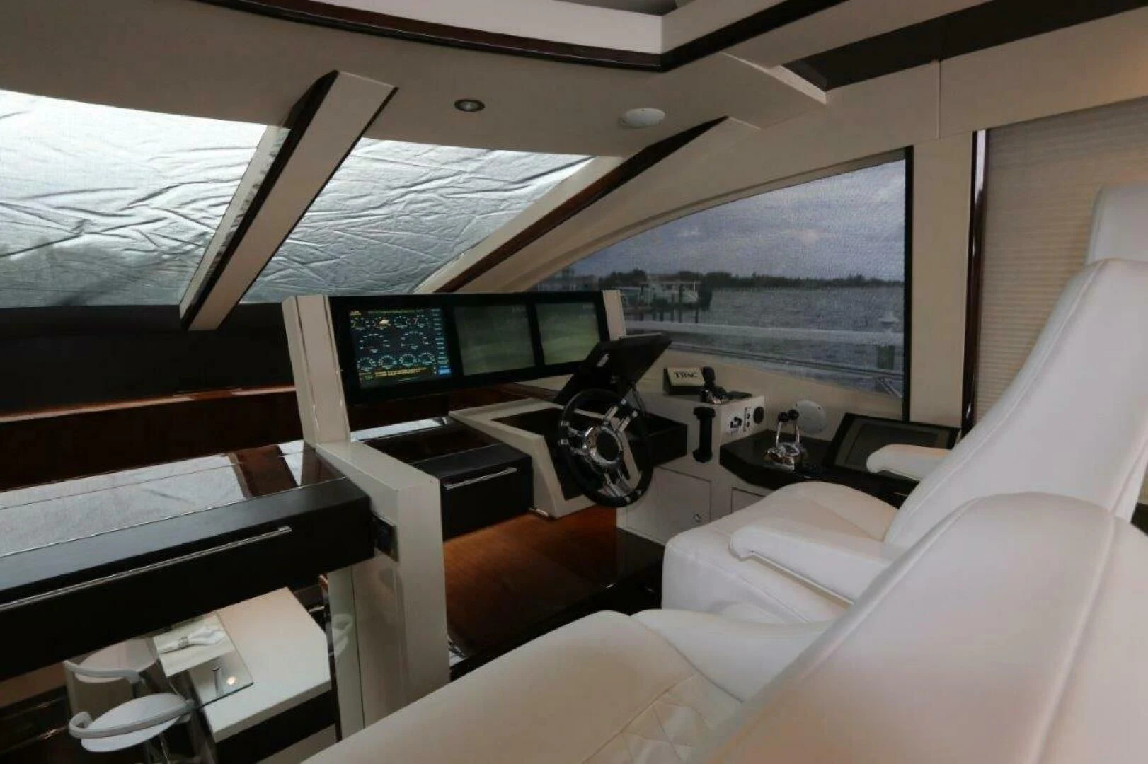 a room with a large window and a desk with a computer and a large window aboard BG Yacht for Sale