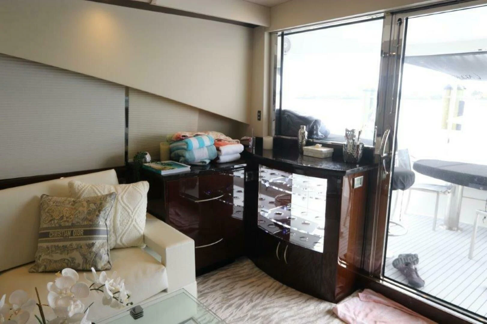 a living room with a glass door aboard BG Yacht for Sale