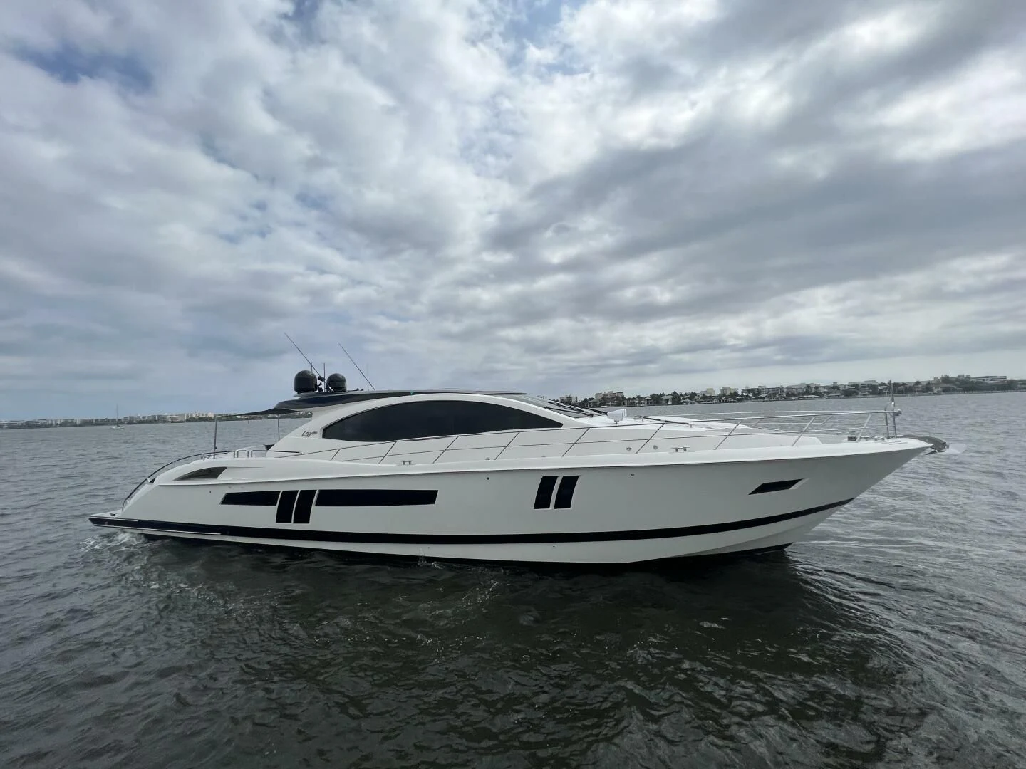 a white boat in the water aboard BG Yacht for Sale