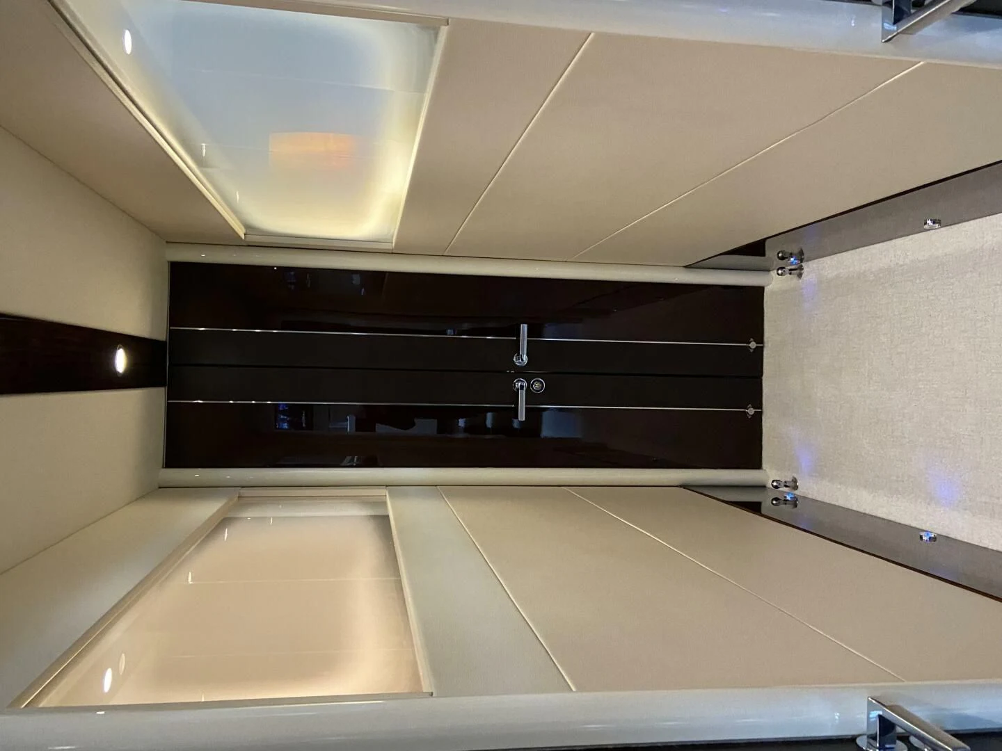 a kitchen with white cabinets aboard BG Yacht for Sale