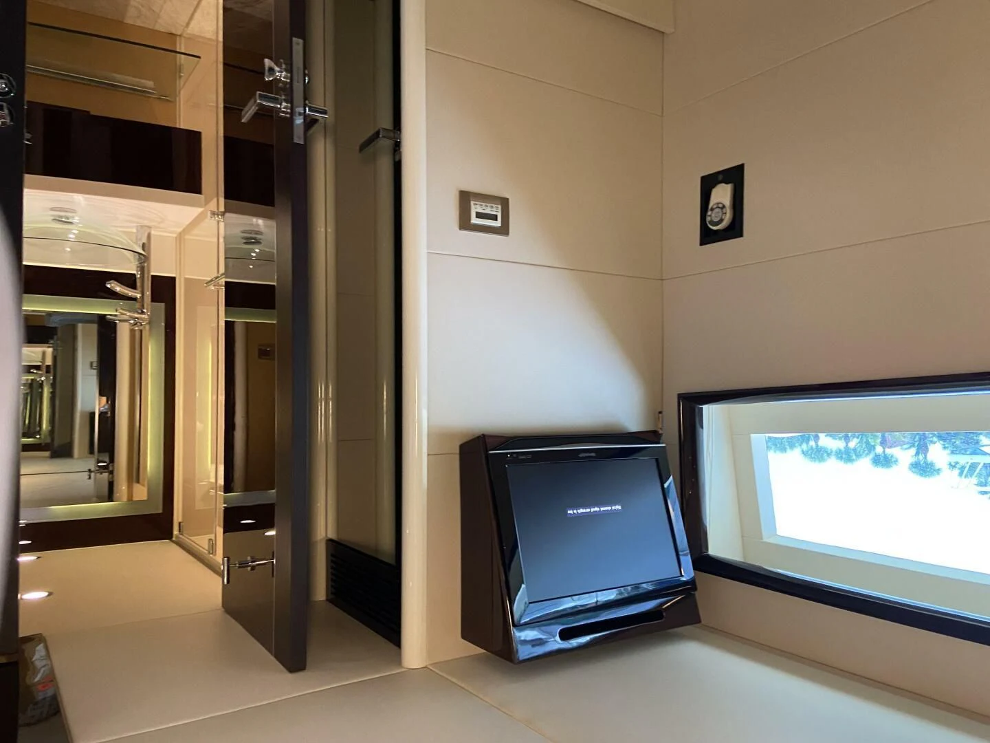 a computer on a table aboard BG Yacht for Sale