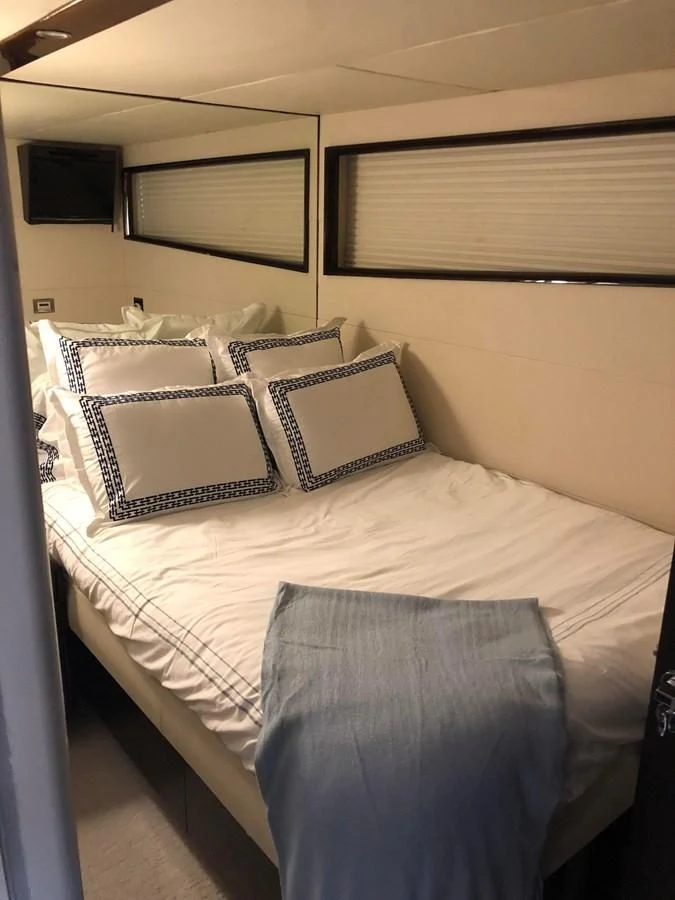 a bed with pillows aboard BG Yacht for Sale