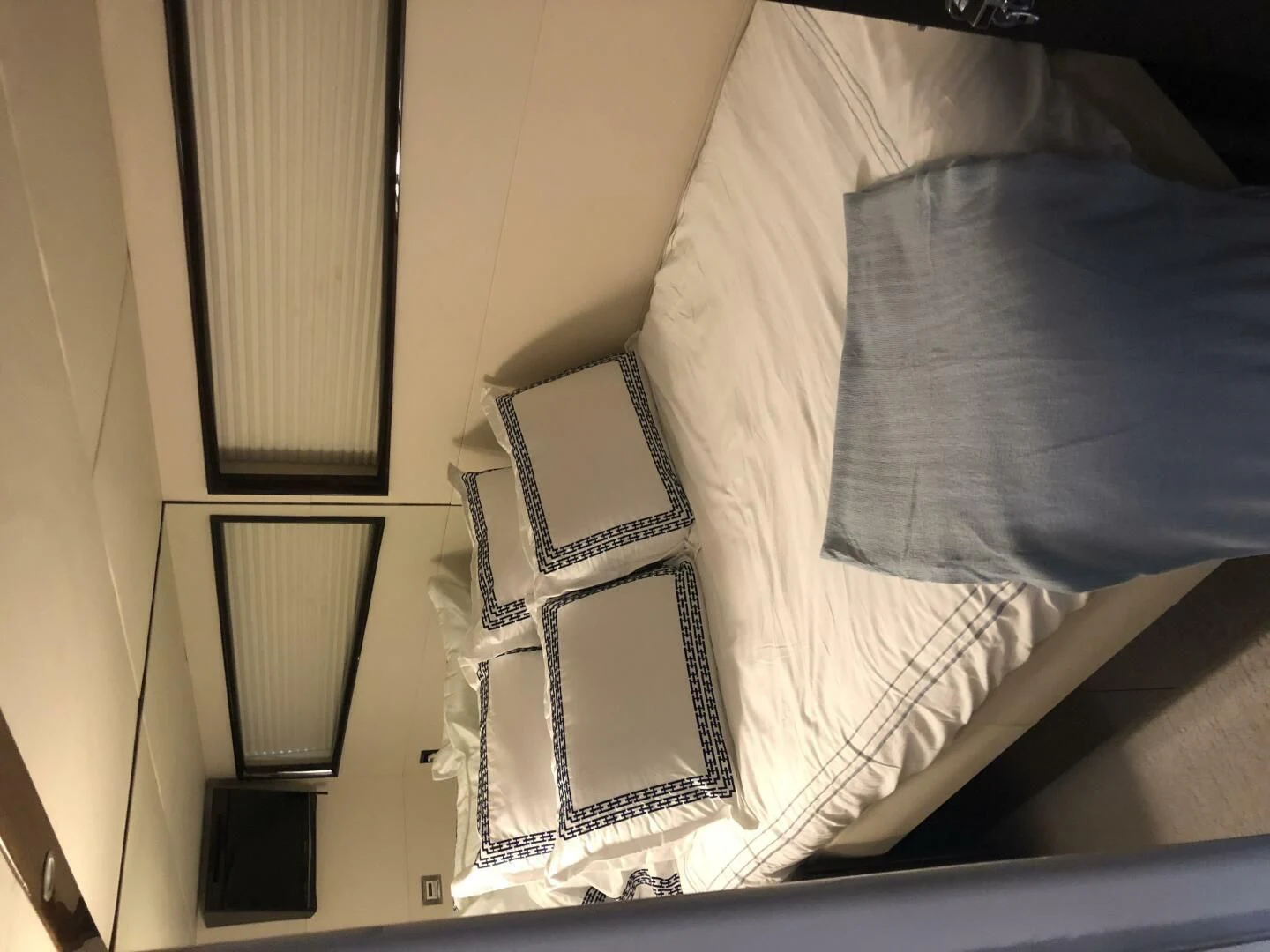 a white and black striped pillow aboard BG Yacht for Sale