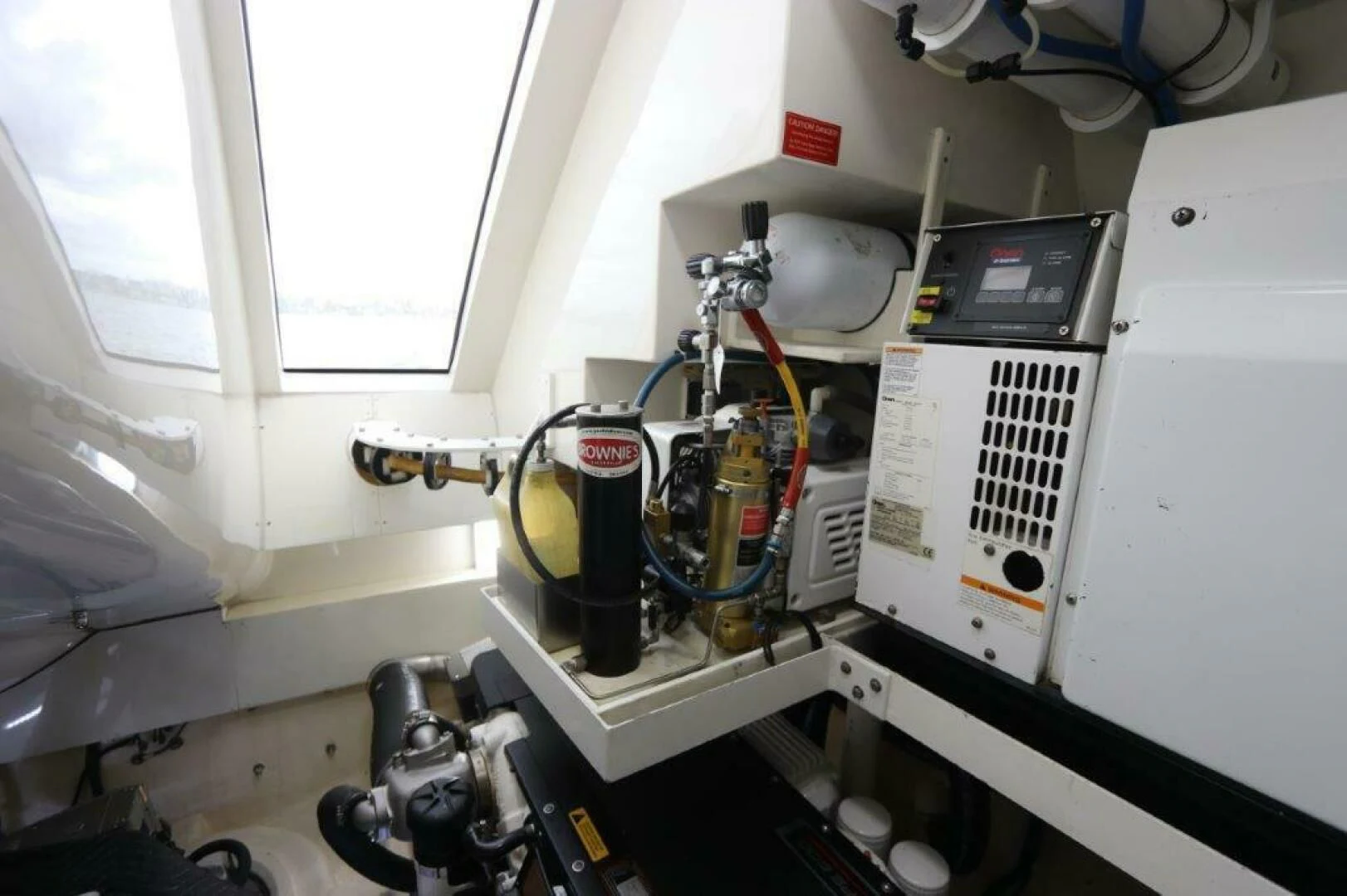 a machine with a large piece of equipment in it aboard BG Yacht for Sale