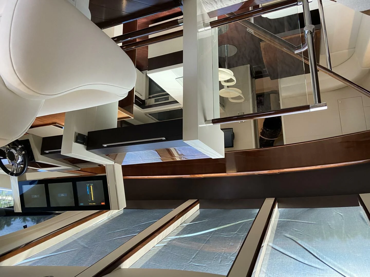 a desk with a computer and a lamp aboard BG Yacht for Sale