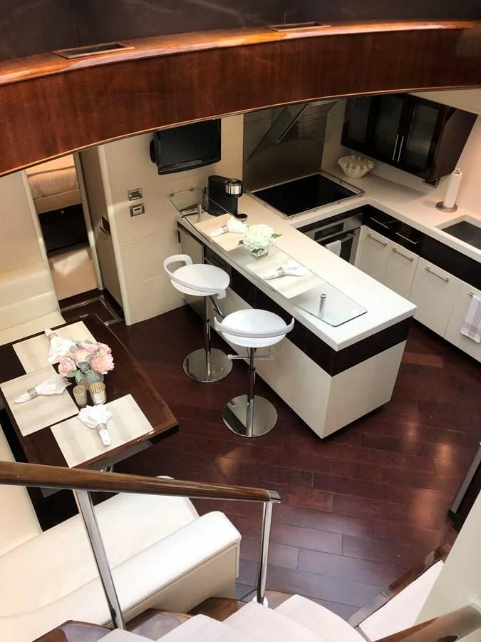 a kitchen with a table and chairs aboard BG Yacht for Sale