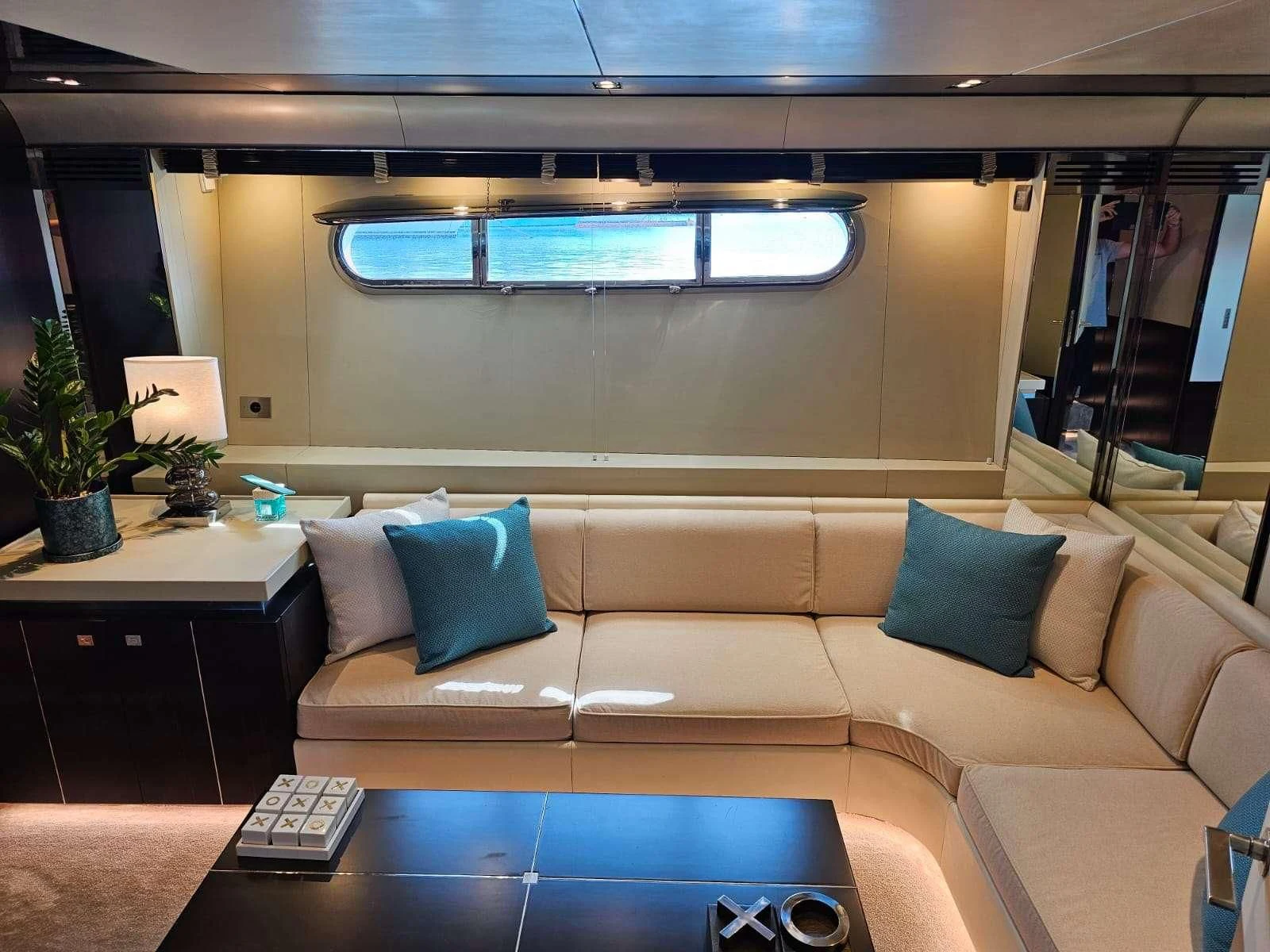 a room with a couch and a tv aboard MAC Yacht for Sale