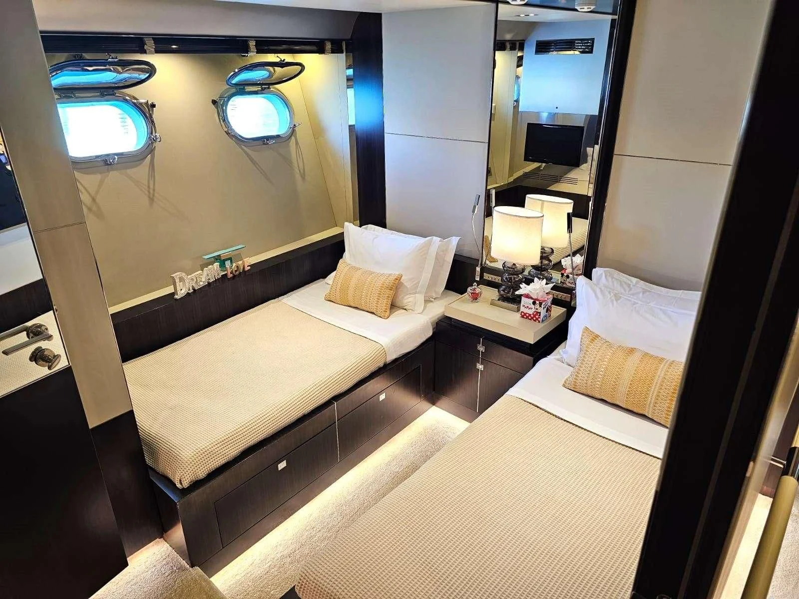 a hotel room with a large mirror aboard MAC Yacht for Sale