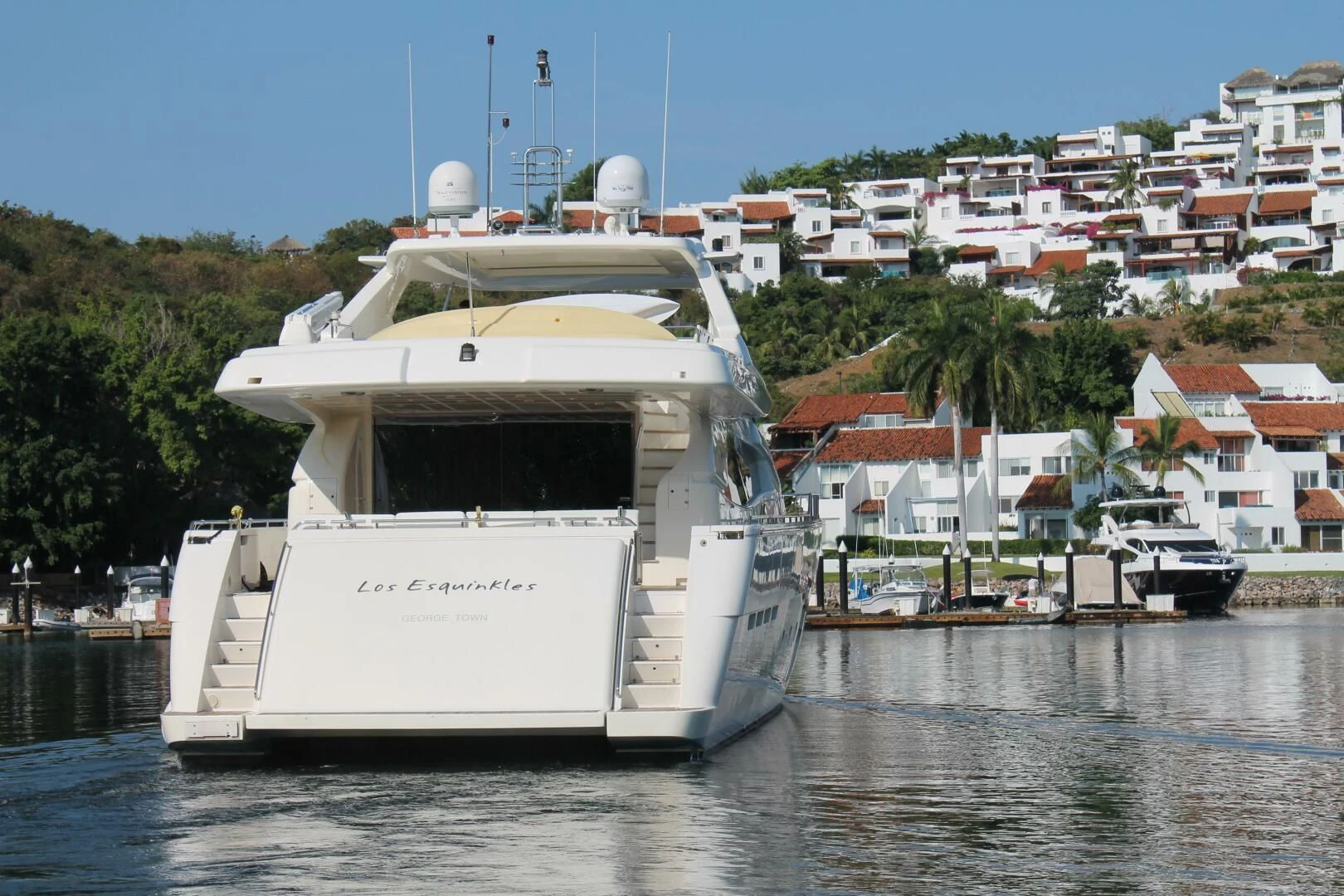 a white boat in the water aboard LOS ESQUINKLIES Yacht for Sale