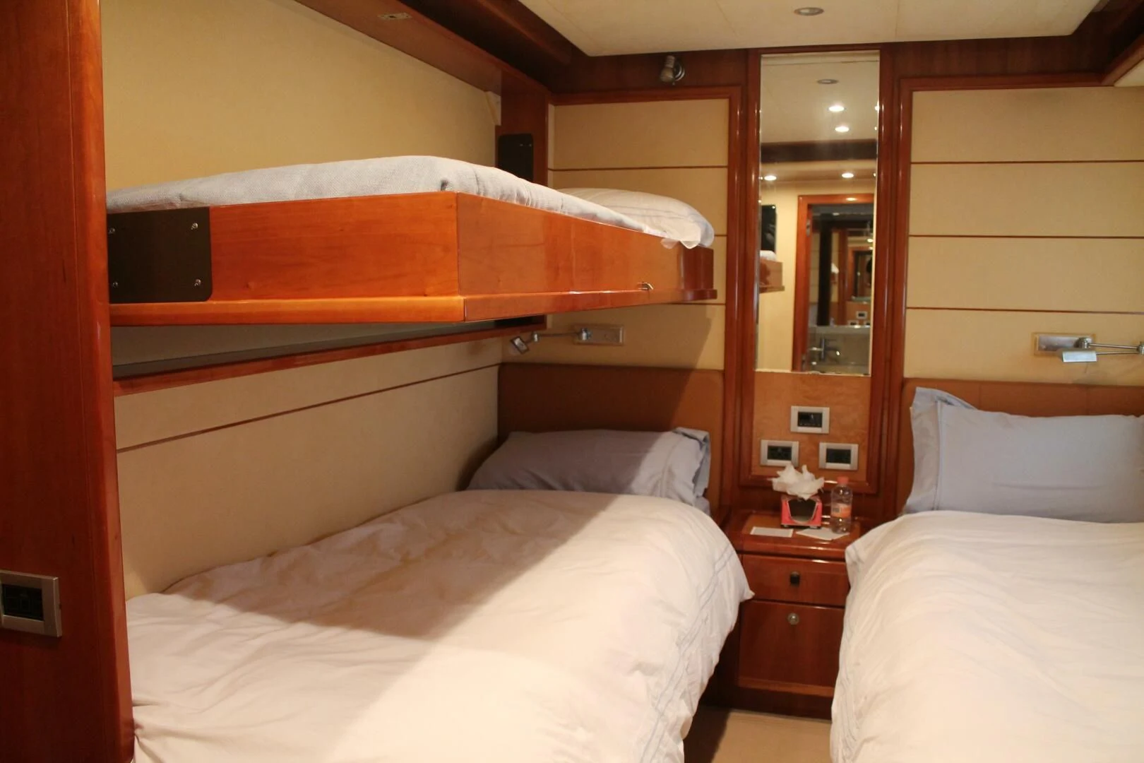 a room with a bed and a mirror aboard LOS ESQUINKLIES Yacht for Sale