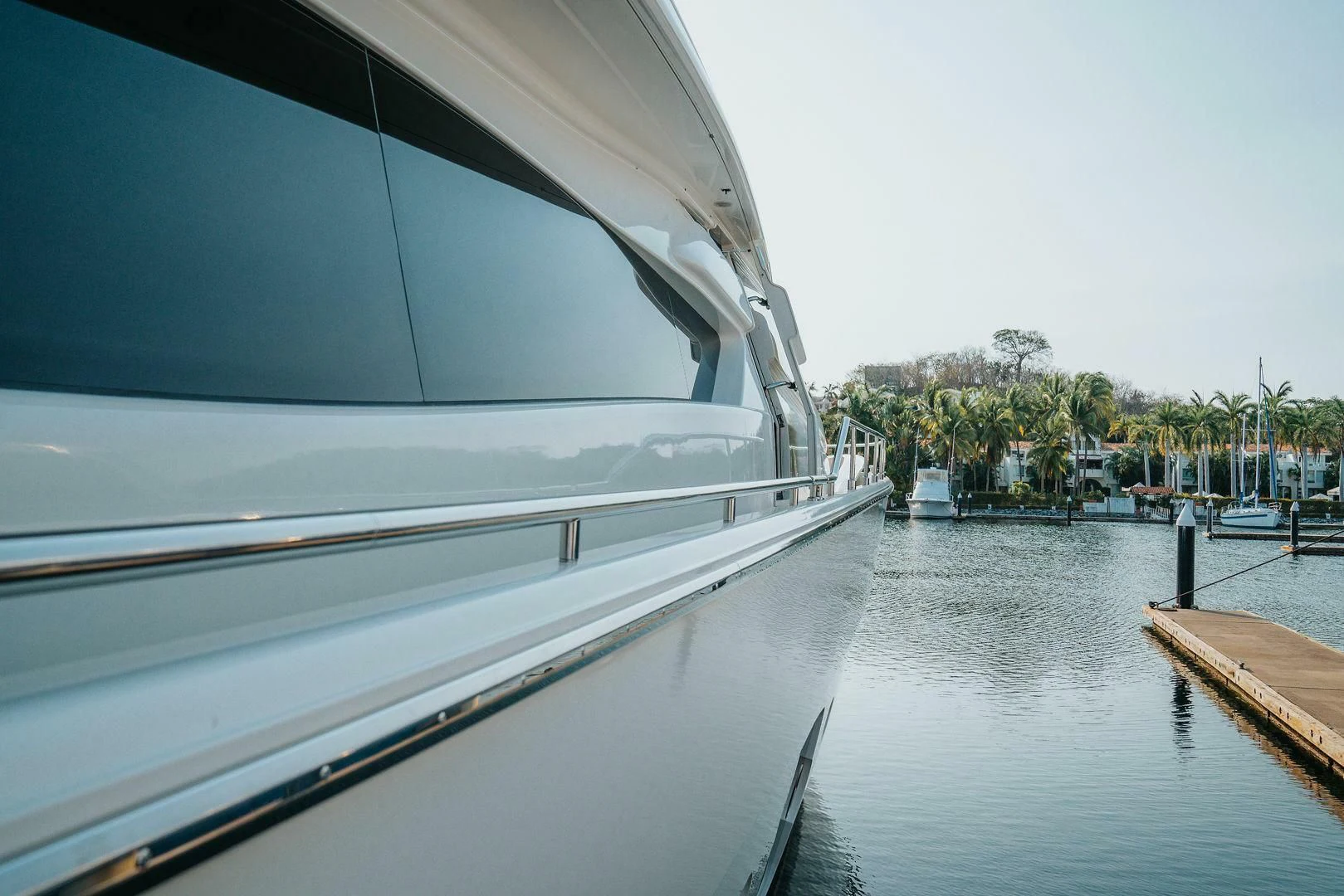 a boat is parked on the side of the water aboard LOS ESQUINKLIES Yacht for Sale