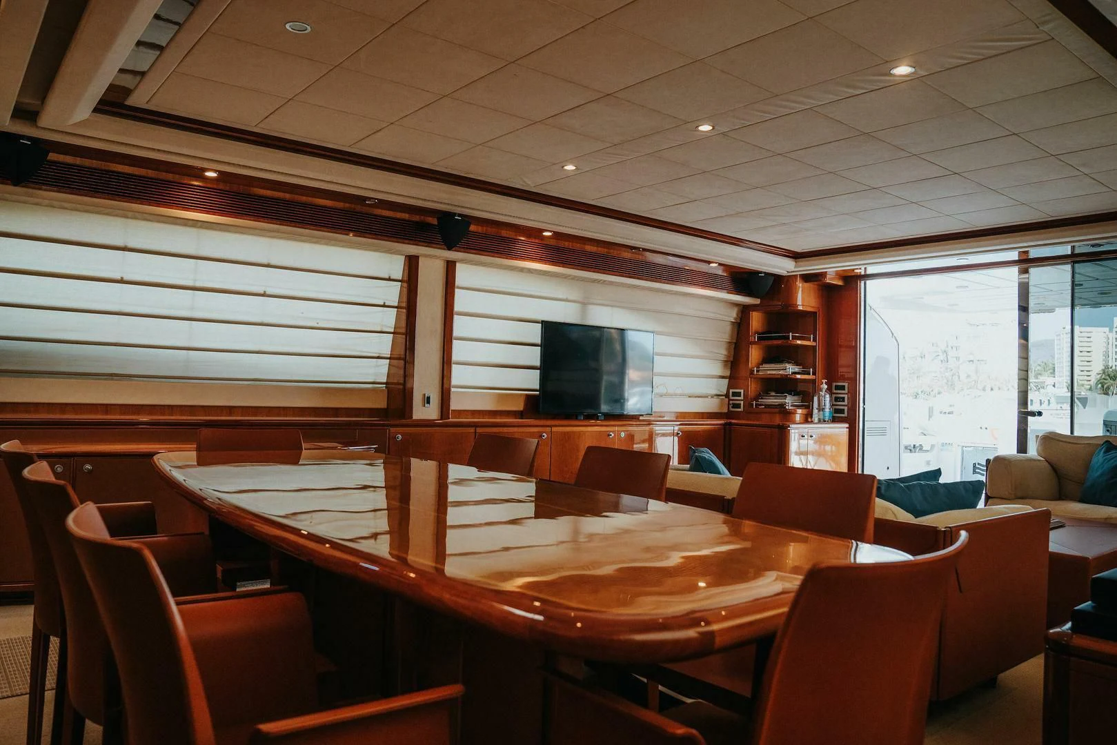 a room with tables and chairs aboard LOS ESQUINKLIES Yacht for Sale