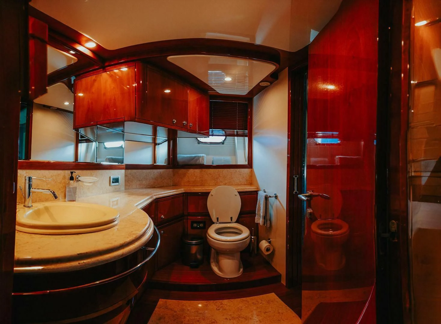 a bathroom with a toilet and sink aboard LOS ESQUINKLIES Yacht for Sale