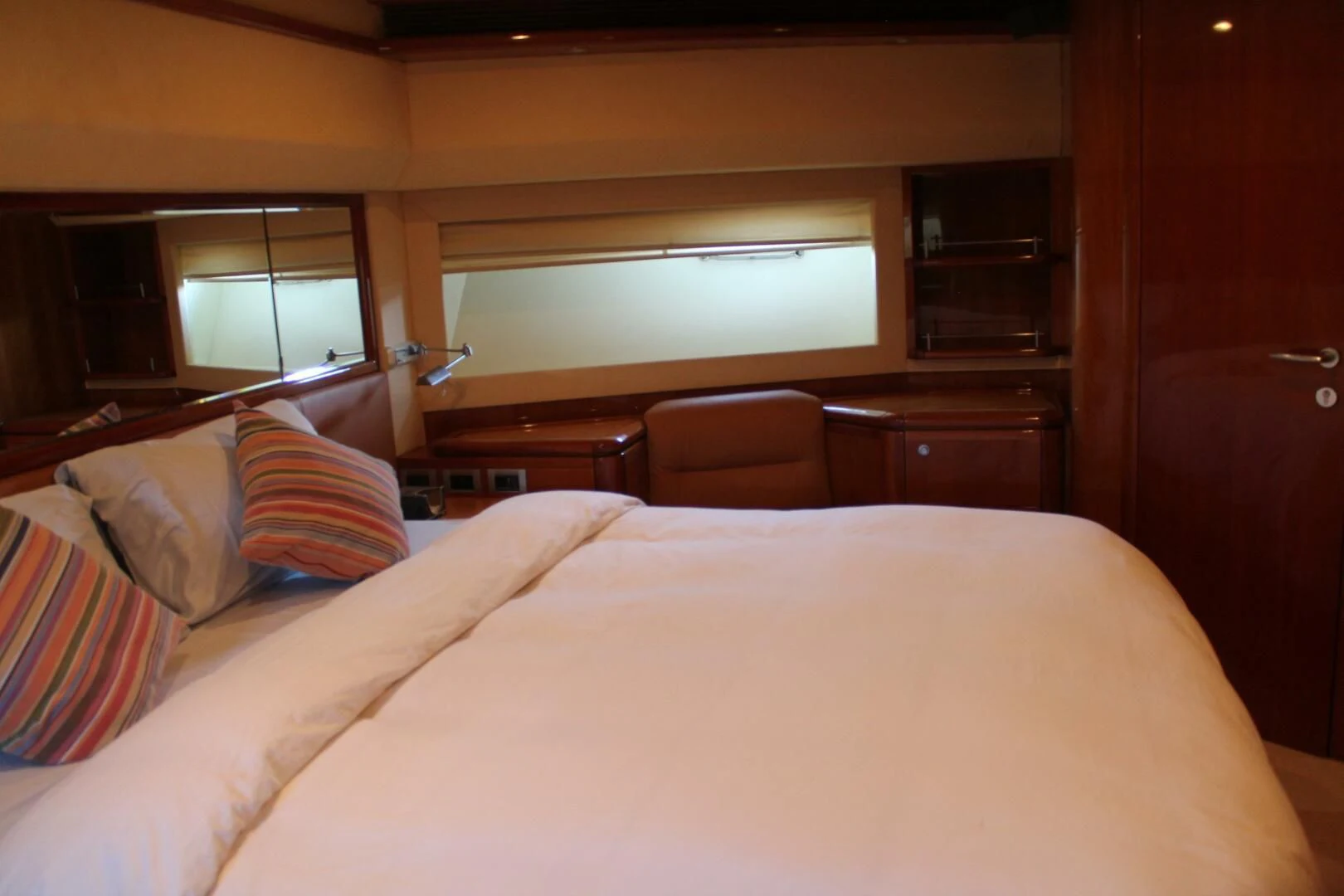a bed with pillows aboard LOS ESQUINKLIES Yacht for Sale