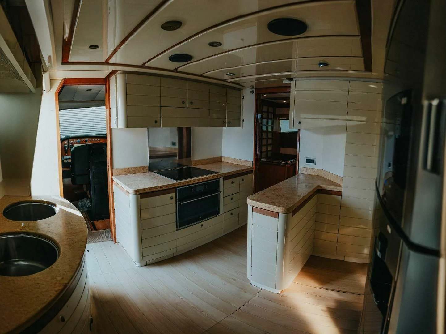 a kitchen with a sink and stove aboard LOS ESQUINKLIES Yacht for Sale