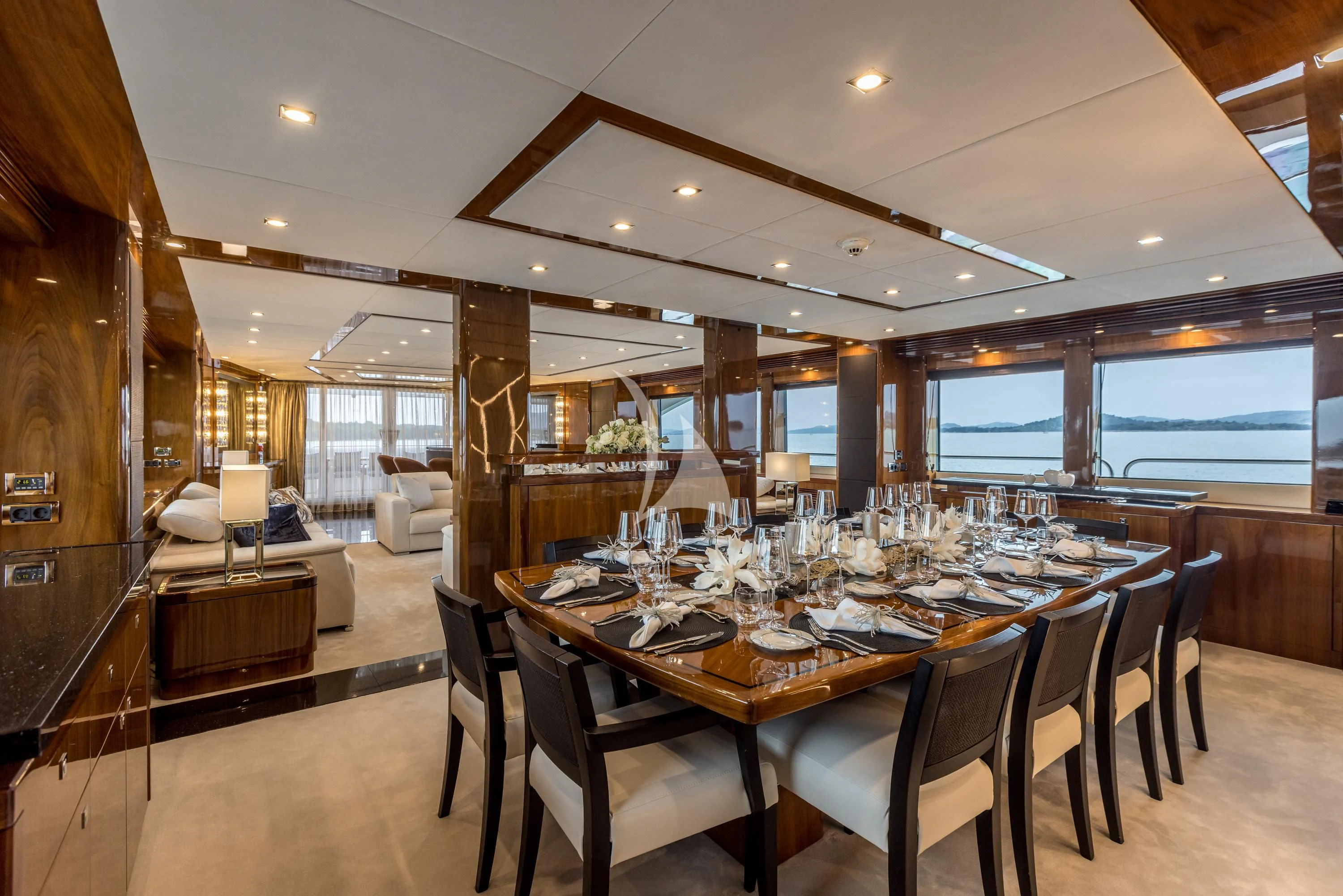 a large dining table in a large room with a large window aboard KATARIINA I Yacht for Sale