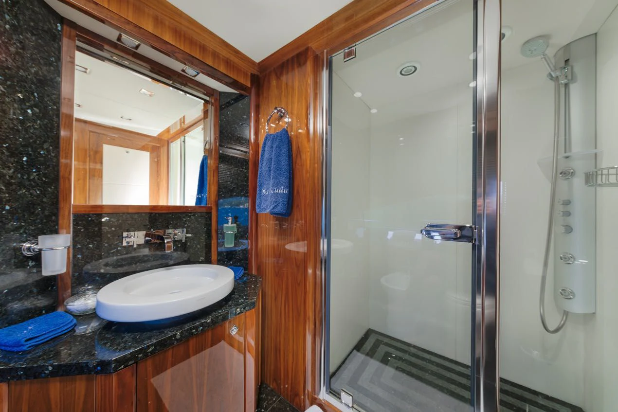 a bathroom with a glass shower aboard KATARIINA I Yacht for Sale