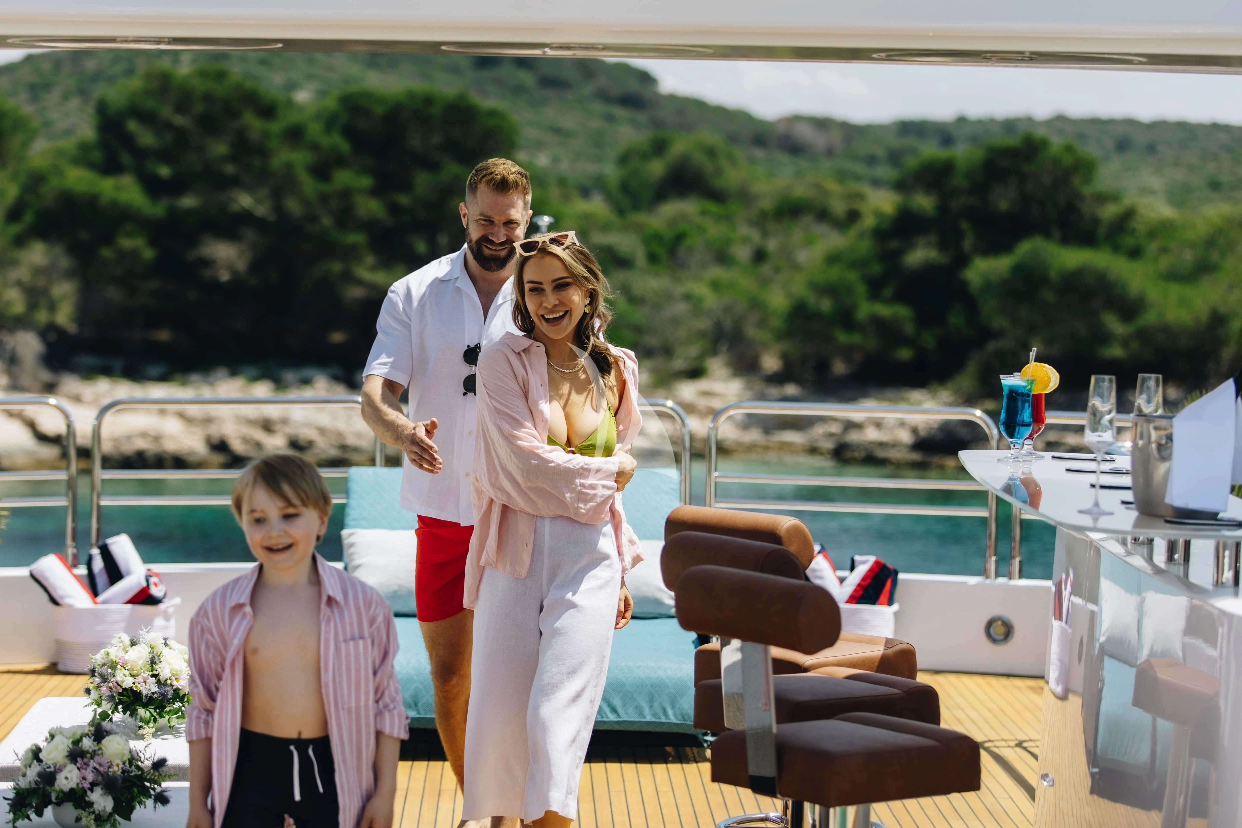 a group of people posing for a photo aboard KATARIINA I Yacht for Sale